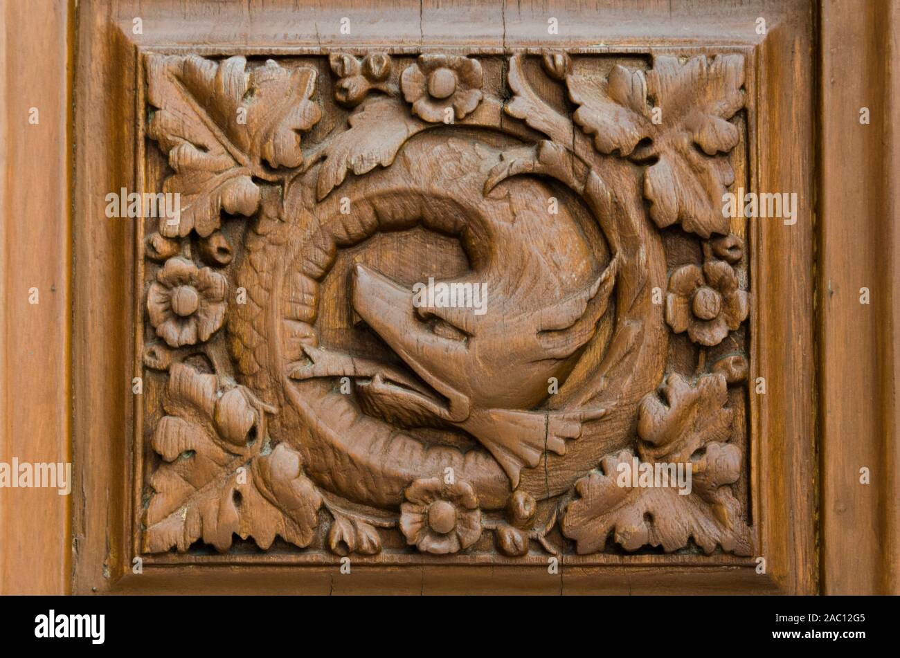 Mexico city / Mexico; May 21, 2014: wood carving representing Quetzalcoatl, the Mesoamerican feathered serpent, detail of a door of Chapultepec Castle Stock Photo