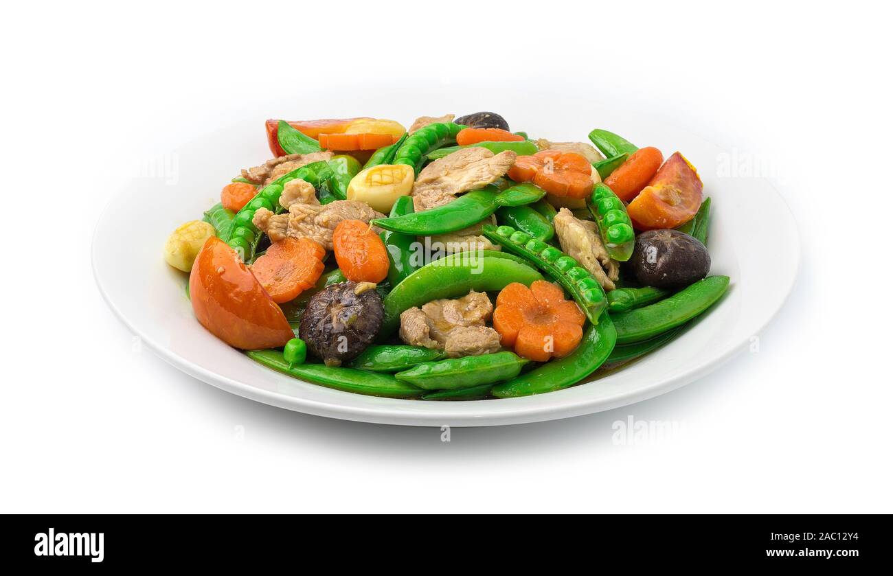 Stir Fried Snow Peas with Pork and Carved Carrots flower and corn shap and Garlic (Thua Lantao Phat Moo) Asian Food & Thai cooked fusion style side vi Stock Photo