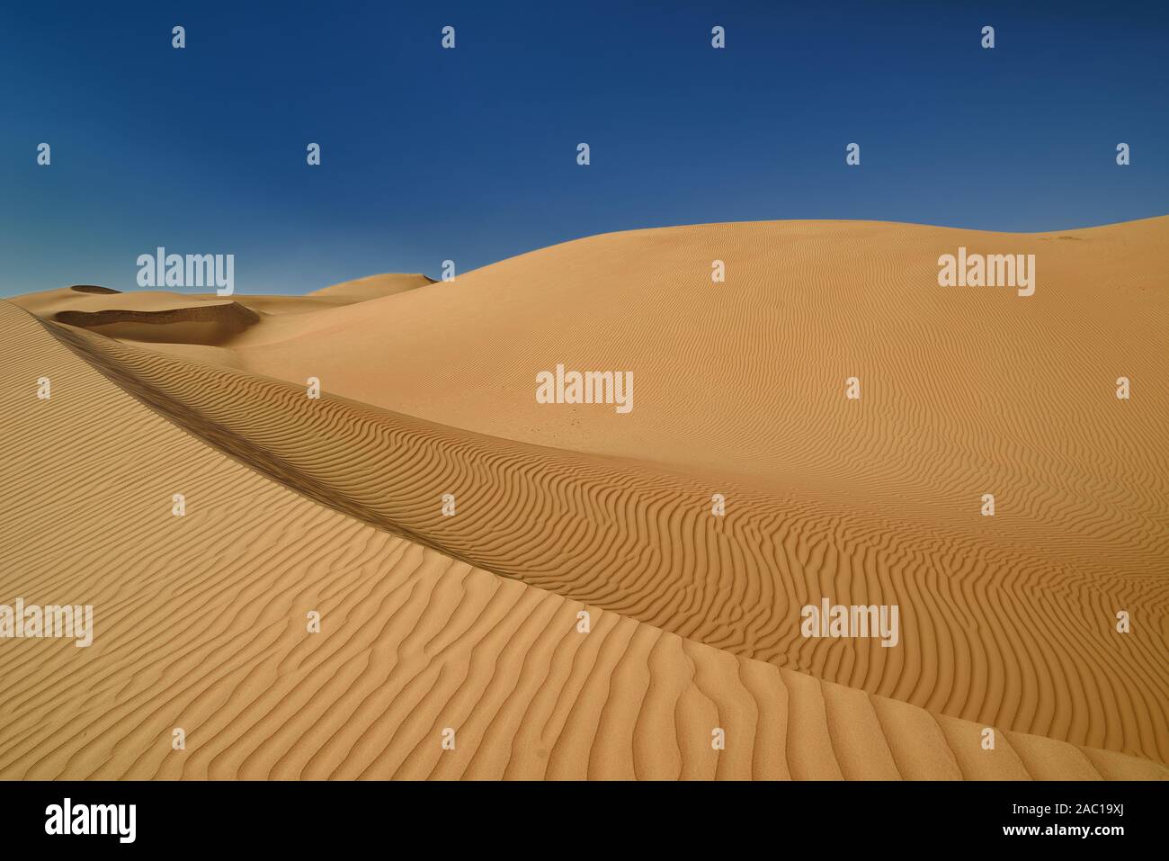 The Wahiba Sands desert in Oman beautiful shaped desert dunes Stock Photo