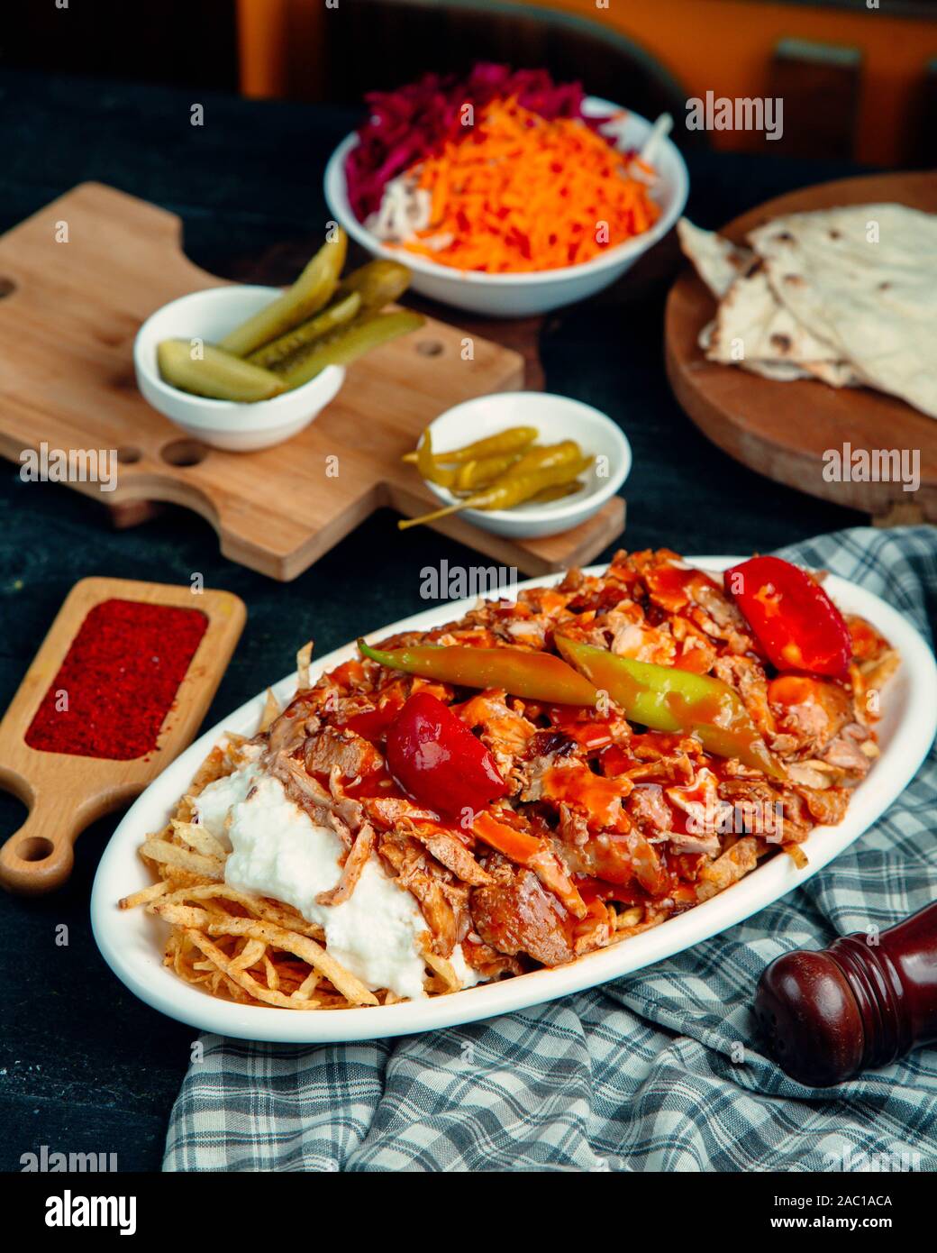 lamb doner kebab garnished with tomato and pepper, served with fries
