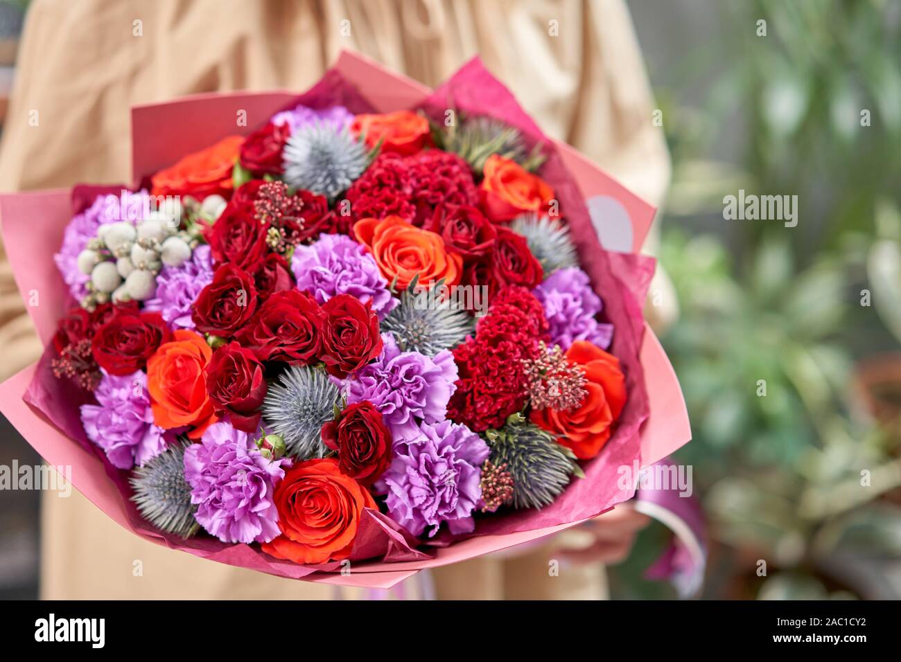 Modern floral shop. Finished work of the florist. Cute bouquet of mixed
