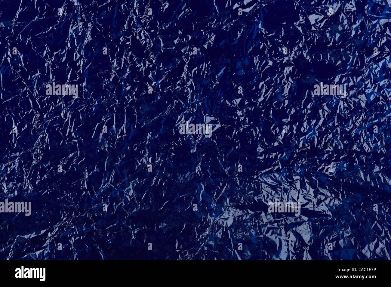 Blue plastic background. Shiny wrinkled crumpled bag surface Stock Photo