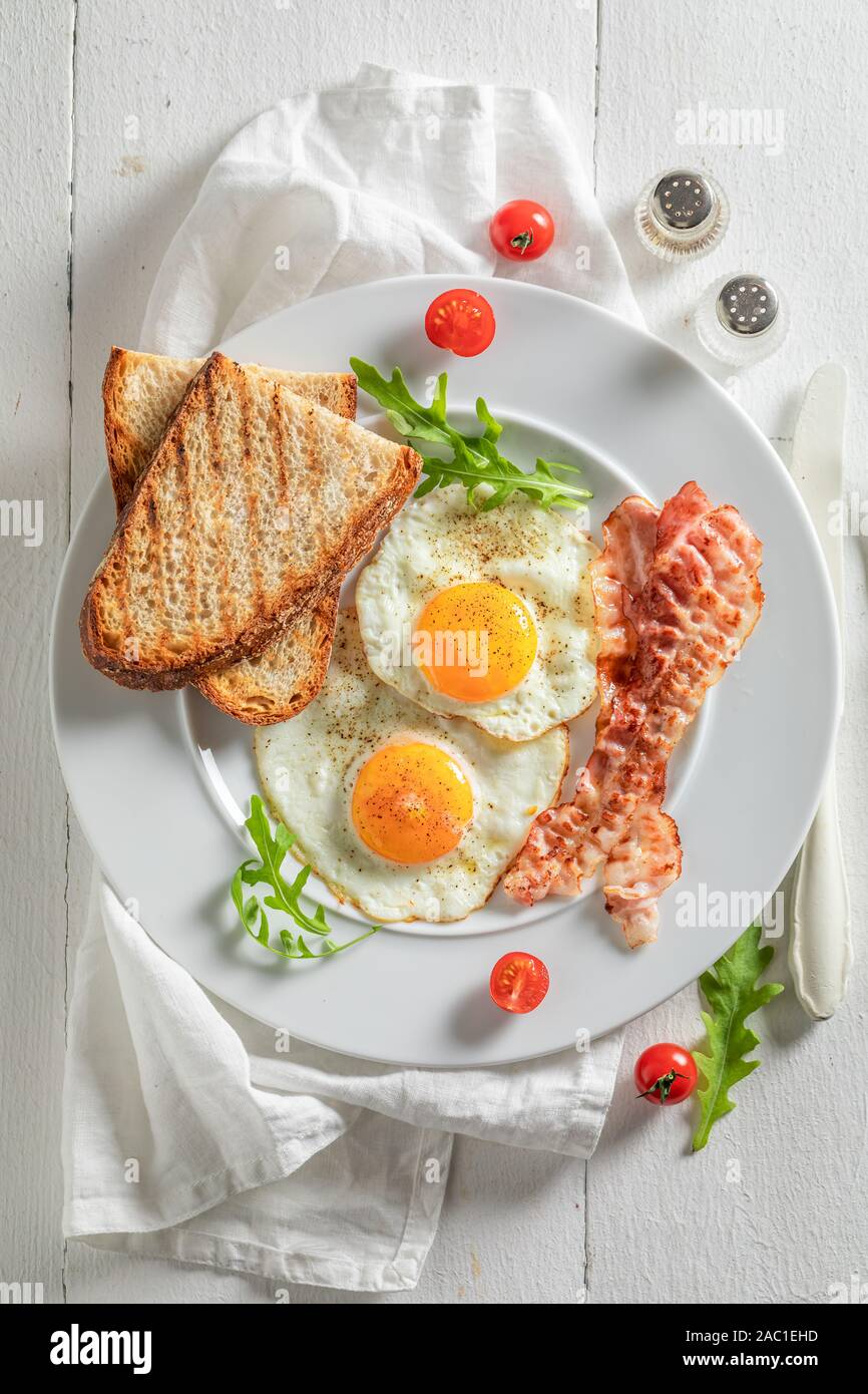 Homemade breakfast with toast, eggs and bacon Stock Photo - Alamy