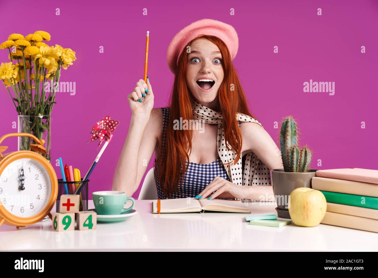 Image Of Excited Teenage Girl Studying With Exercise Books While