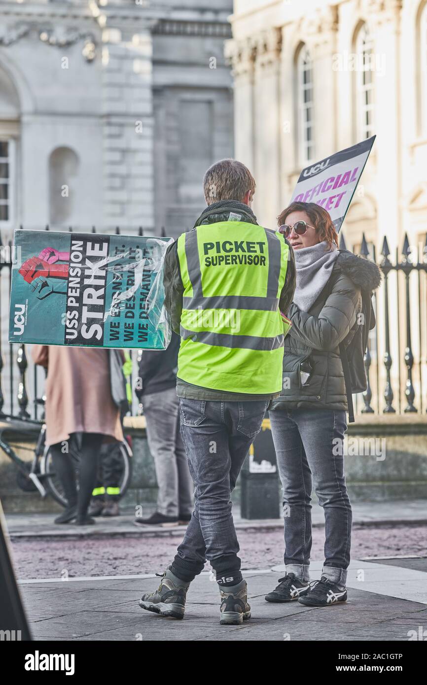 Striking lecturers at Cambridge university, England, stand outside Senate House on Friday 29th November 2019 to protest about changes to their pensions. Stock Photo