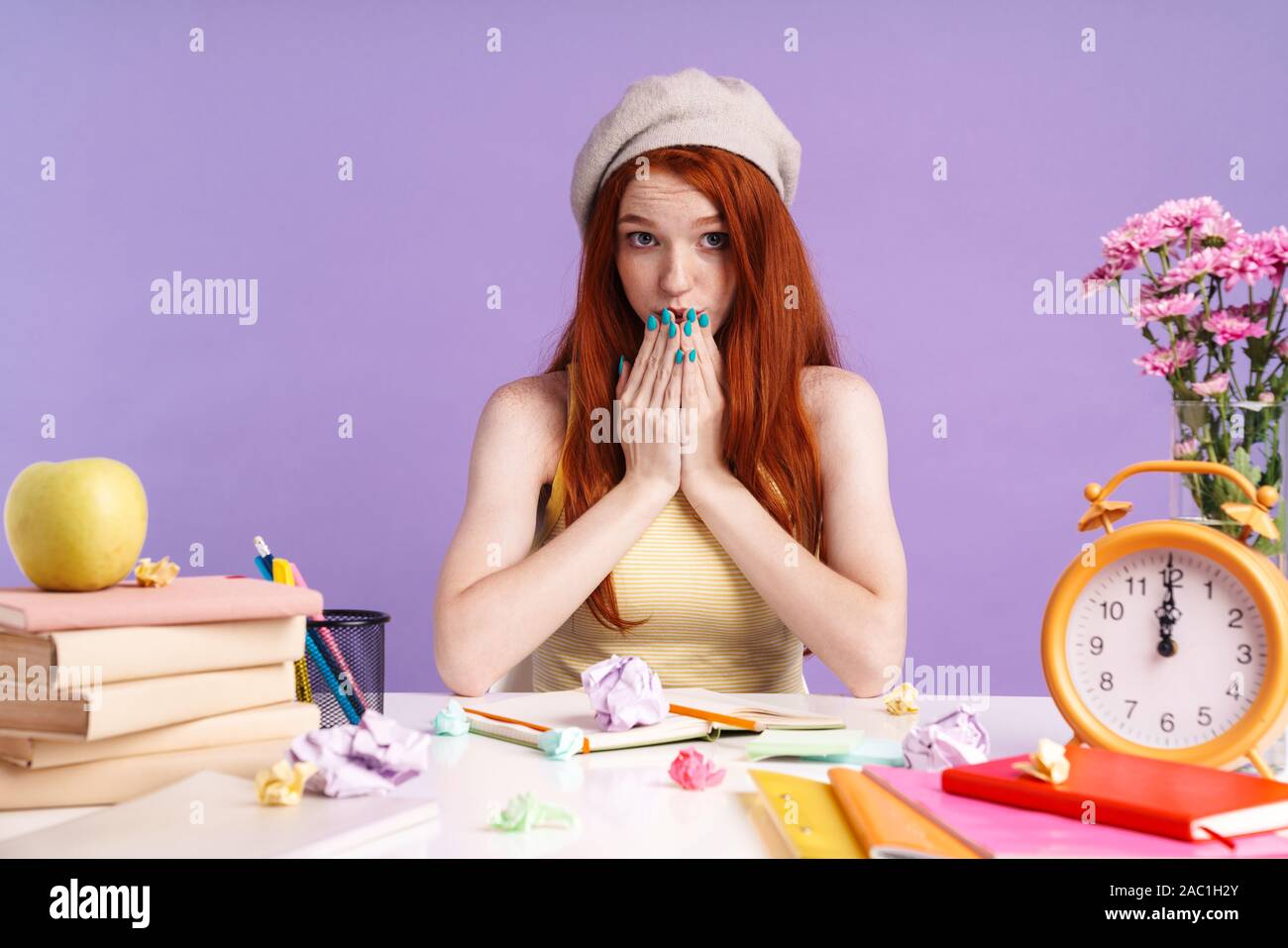 Photo Of Redhead Student Girl Covering Her Mouh While Sitting At