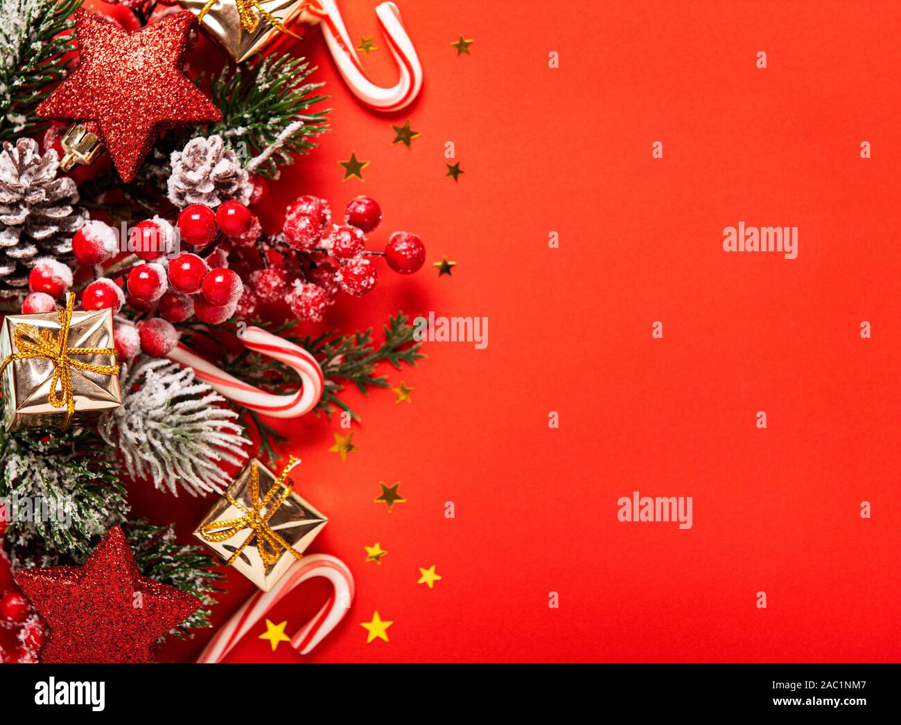 Christmas and New year background with fir branches, holly berry, pine ...