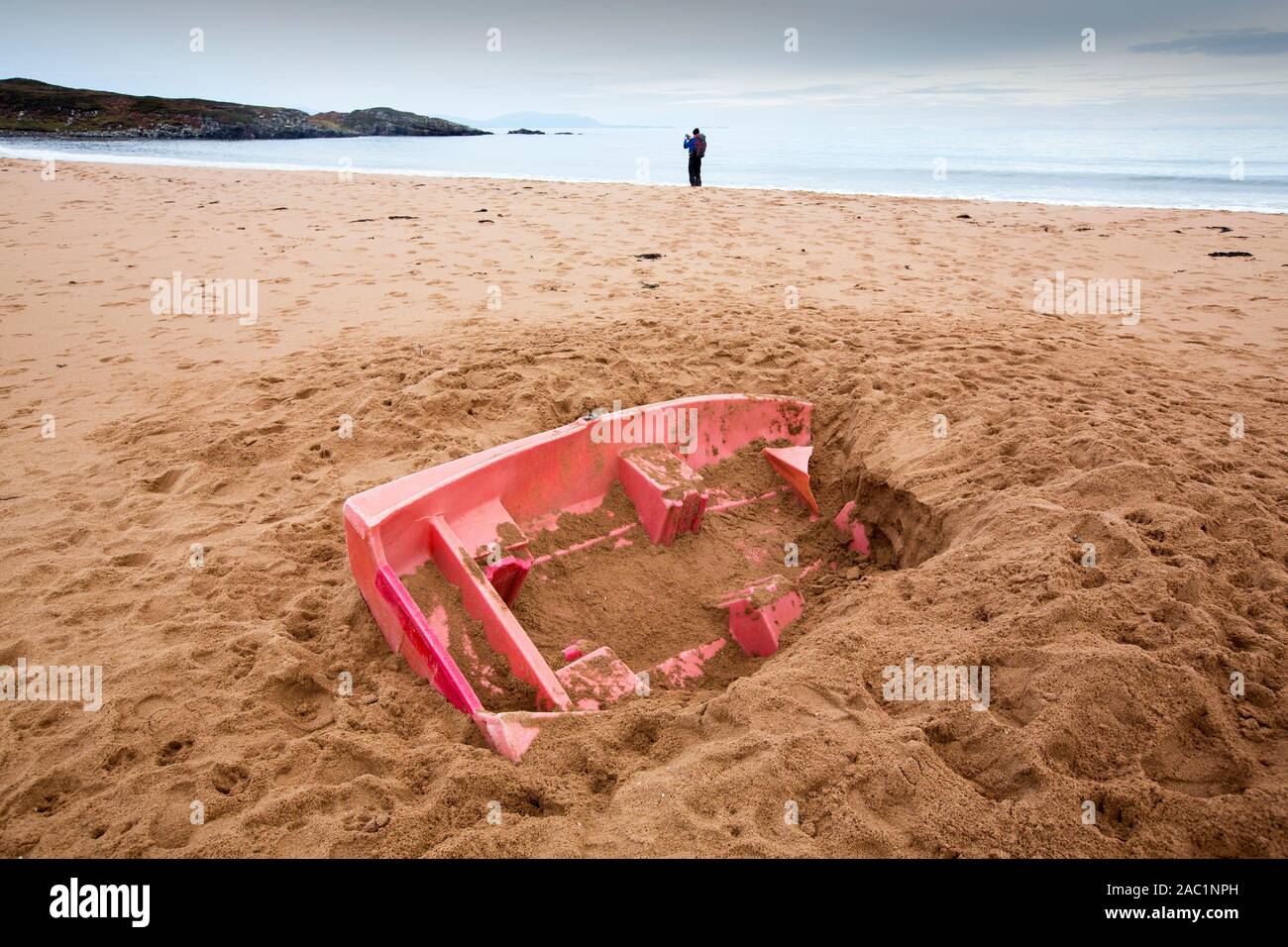 A boat half buried on the beach at Redpoint, west of Gairloch, Scotland