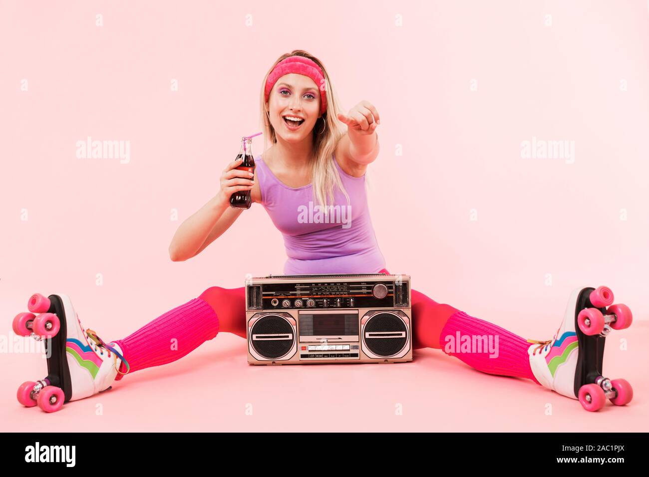 A Looker Leggy Long-haired Young Blonde Woman in a Vintage Roller Skates,  Sunglasses, T-shirt Shorts Sitting on Road. Eye-candy Yo Stock Photo -  Image of american, happy: 84896256