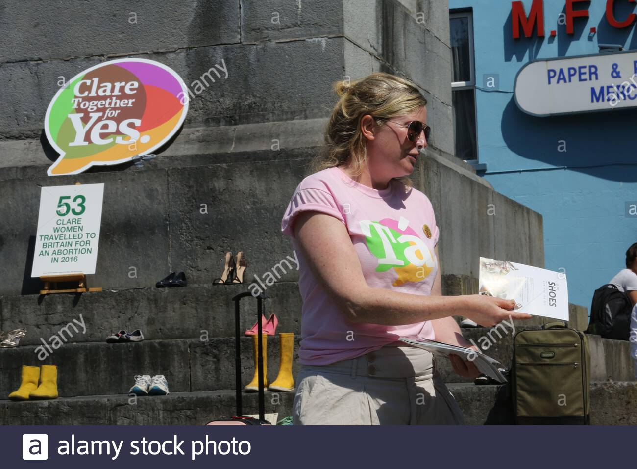 A woman hands out leaflets as part of the Yes campaign to repeal the 8th Amendment of the Irish constitution. Stock Photo