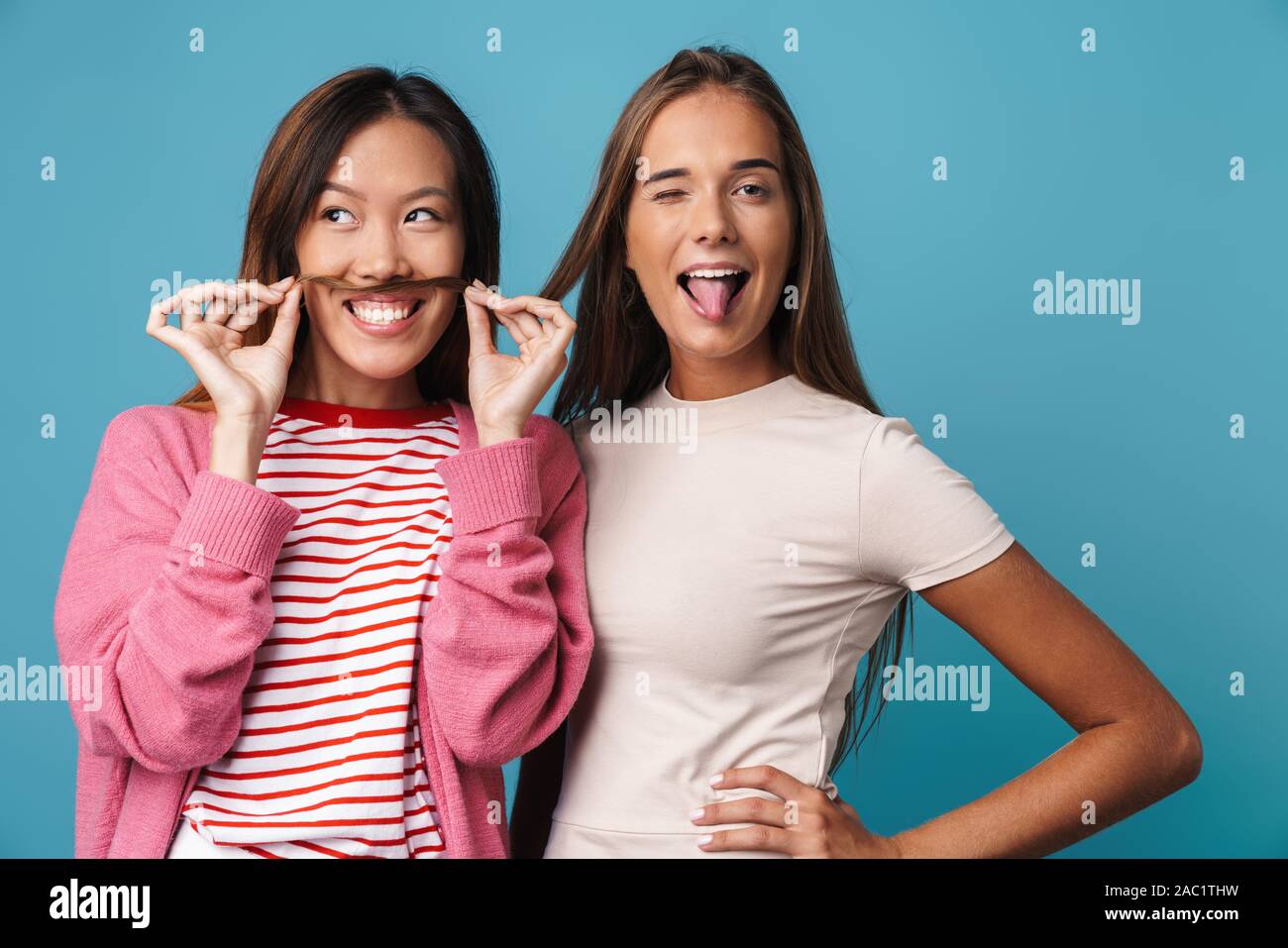 Portrait of multinational cheerful women making fun and grimacing ...