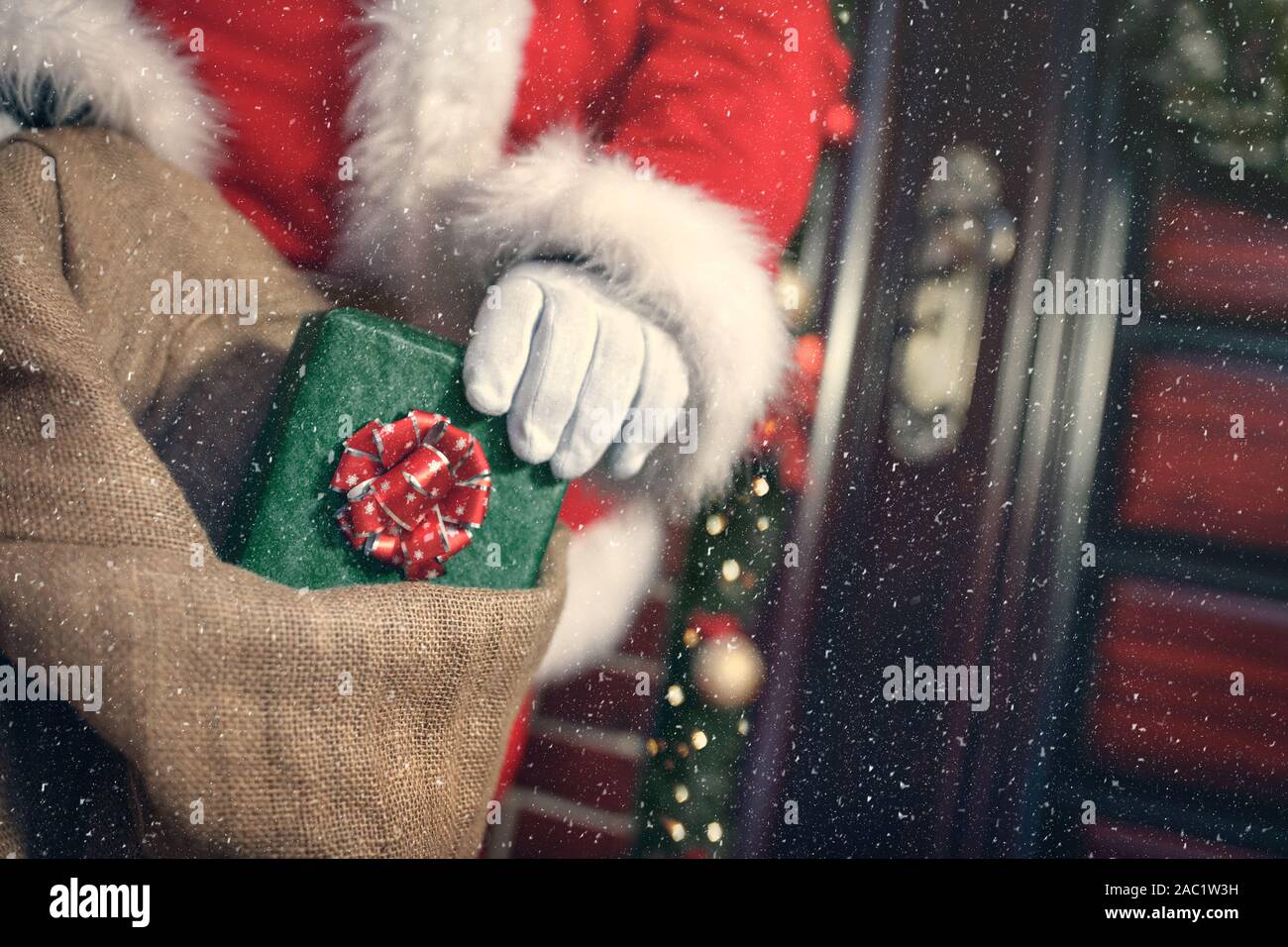 Christmas gifts in suck, Santa Claus taking out Stock Photo