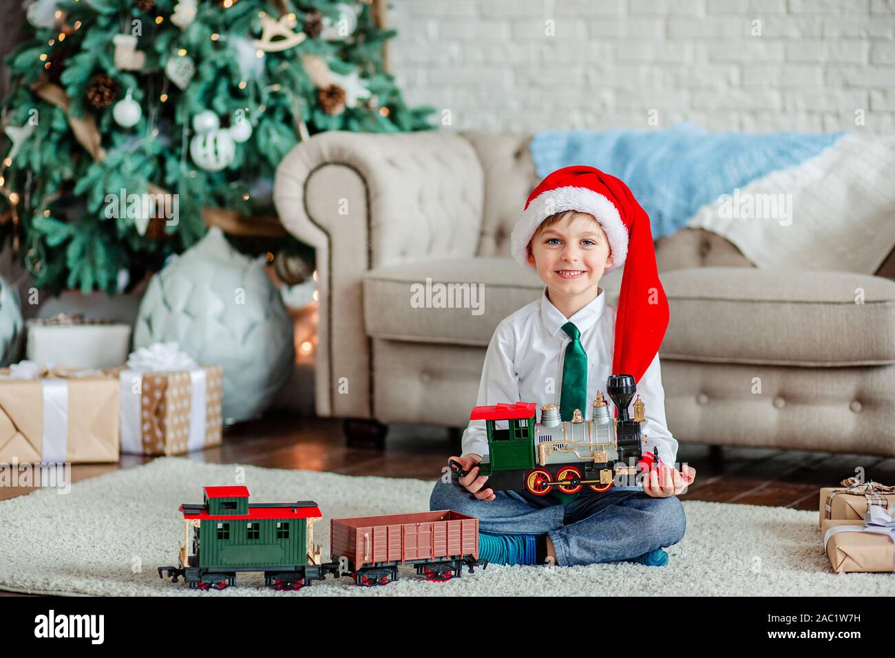 Good Morning Happy Little Boy With A Gift Toy Train Under The