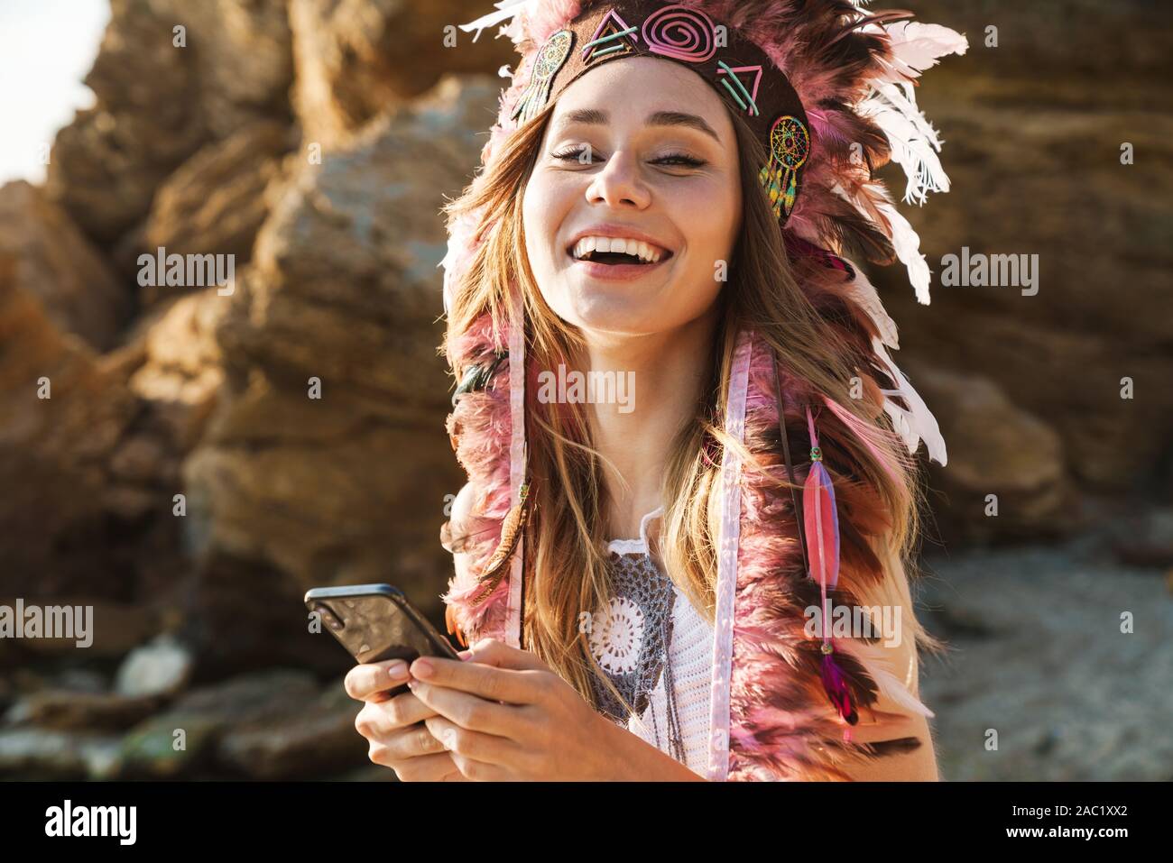Image of happy hippy girl in feather 