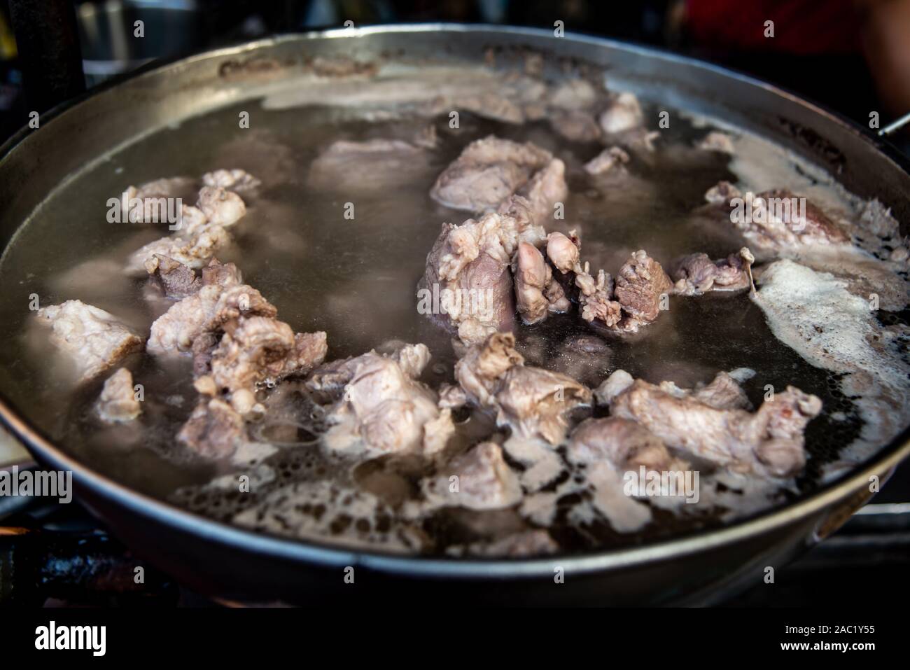 Boiling pork rip soup in hot in pot boiling water, Soup of pork rips