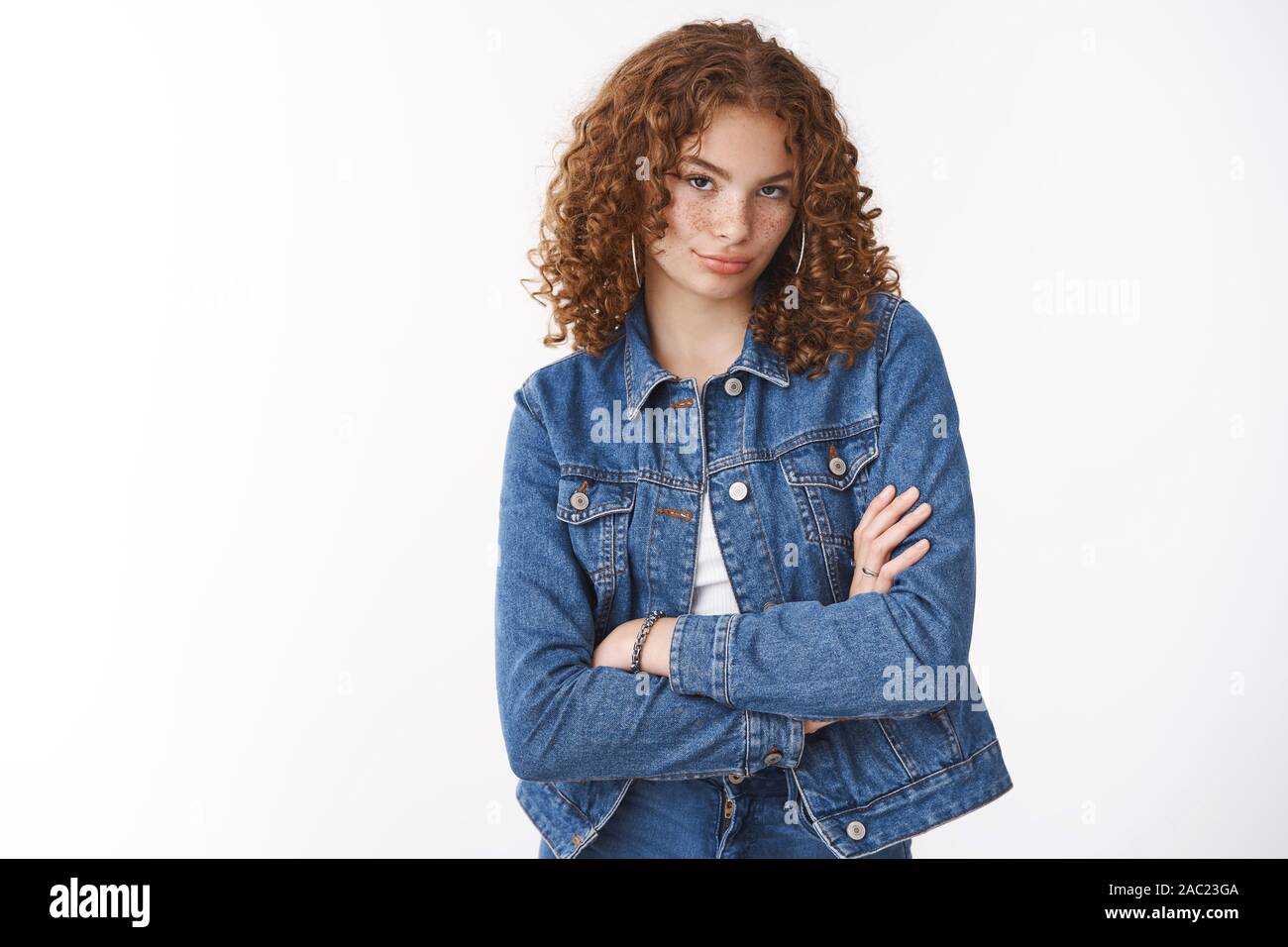 Spoiled young redhead daughter with curly hair freckles pimples acting