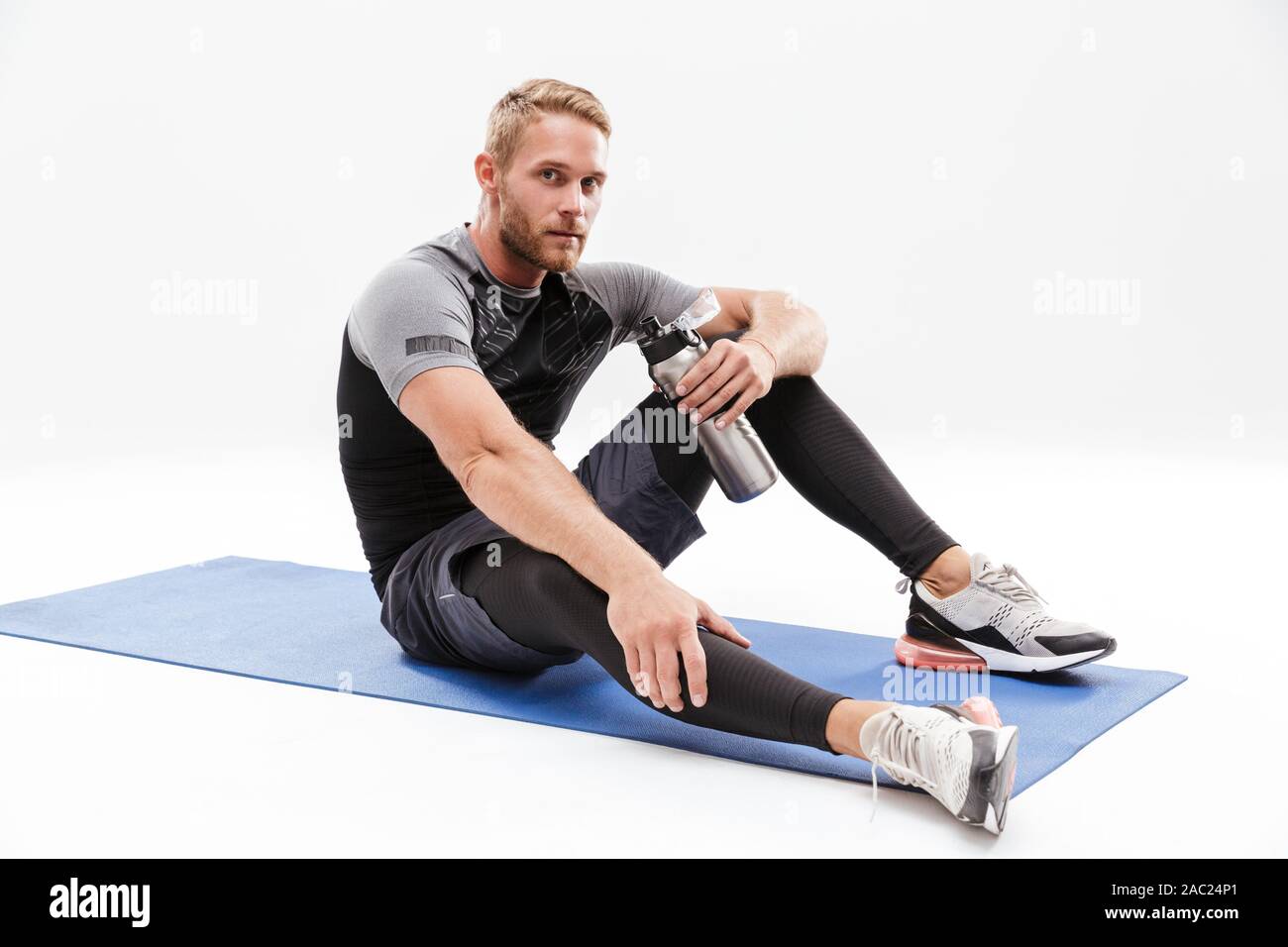 Young athletic man using big bottle of water for home workout 16290443  Stock Photo at Vecteezy