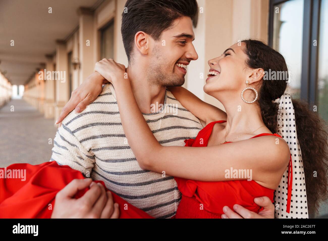 Romantic man carrying woman in hi-res stock photography and images - Alamy