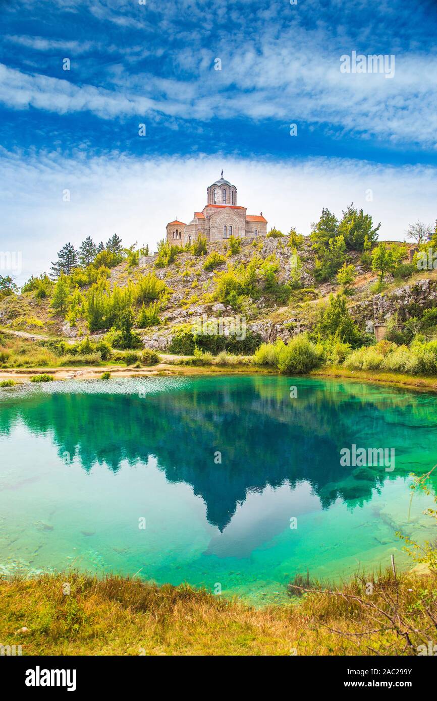 Croatia, Cetina river source water hole and small Orthodox church in