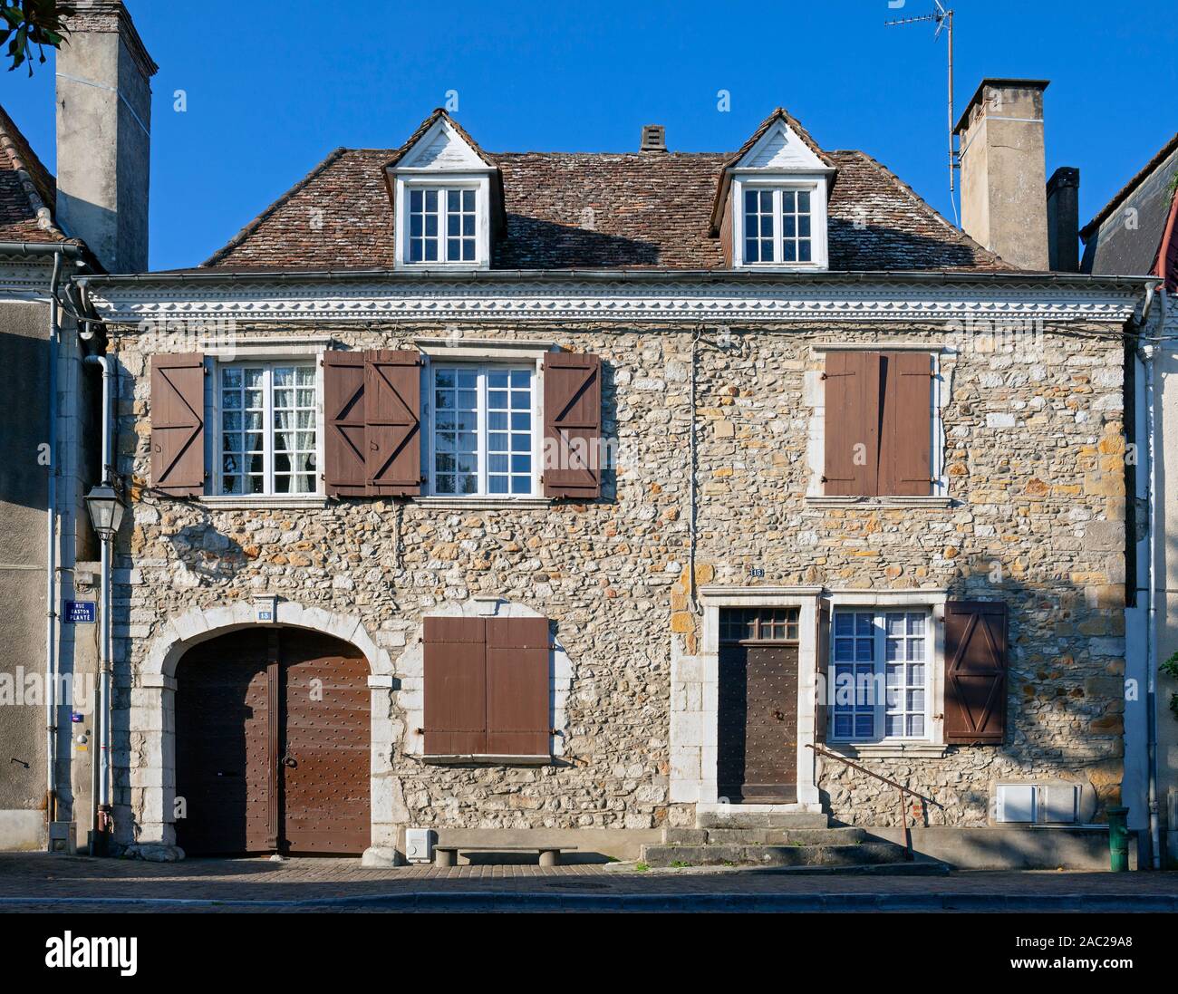 Europe, France, Nouvelle-Aquitaine, Orthez, Typical stone cottage on Rue Gaston Planté Stock Photo