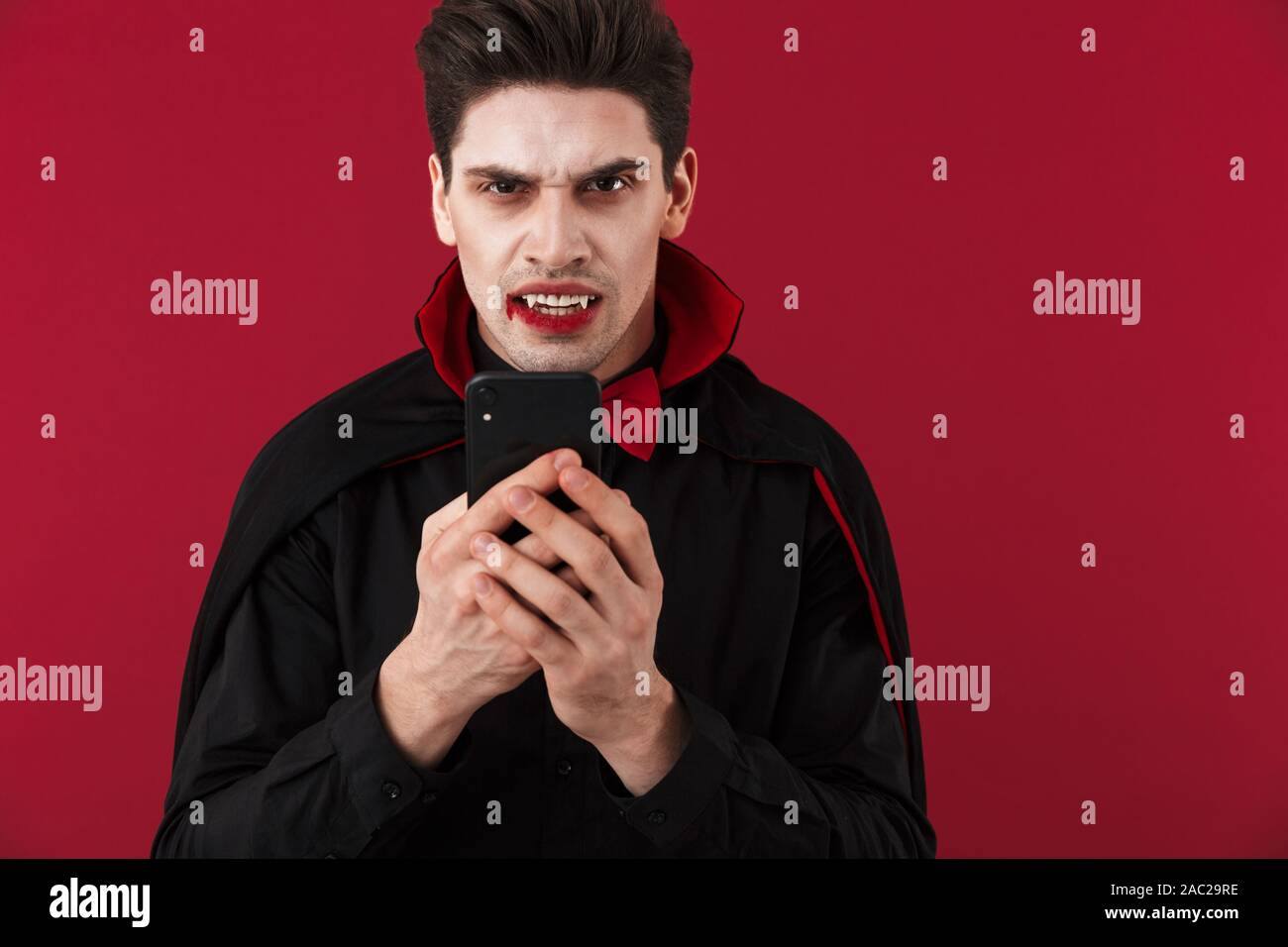 Image Of Vampire Man With Blood And Fangs In Black Halloween