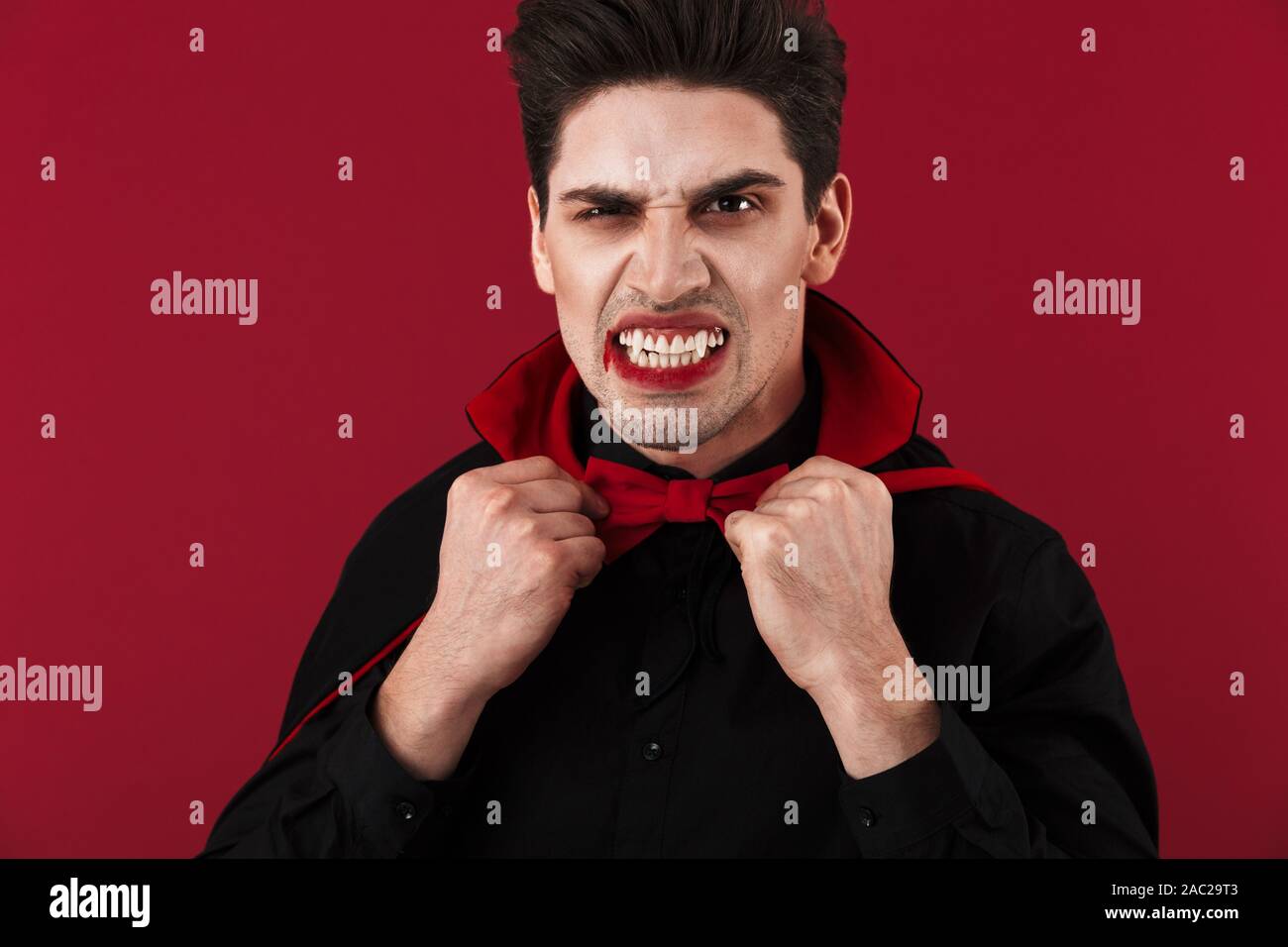 Image Of Evil Vampire Man With Blood And Fangs In Black