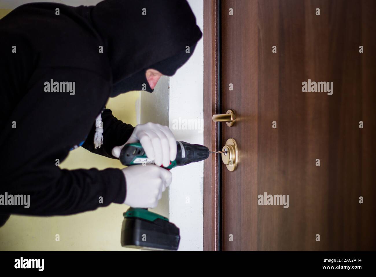 Crime Robbery Masked Thief Burglar Trying To Break Into A Flat