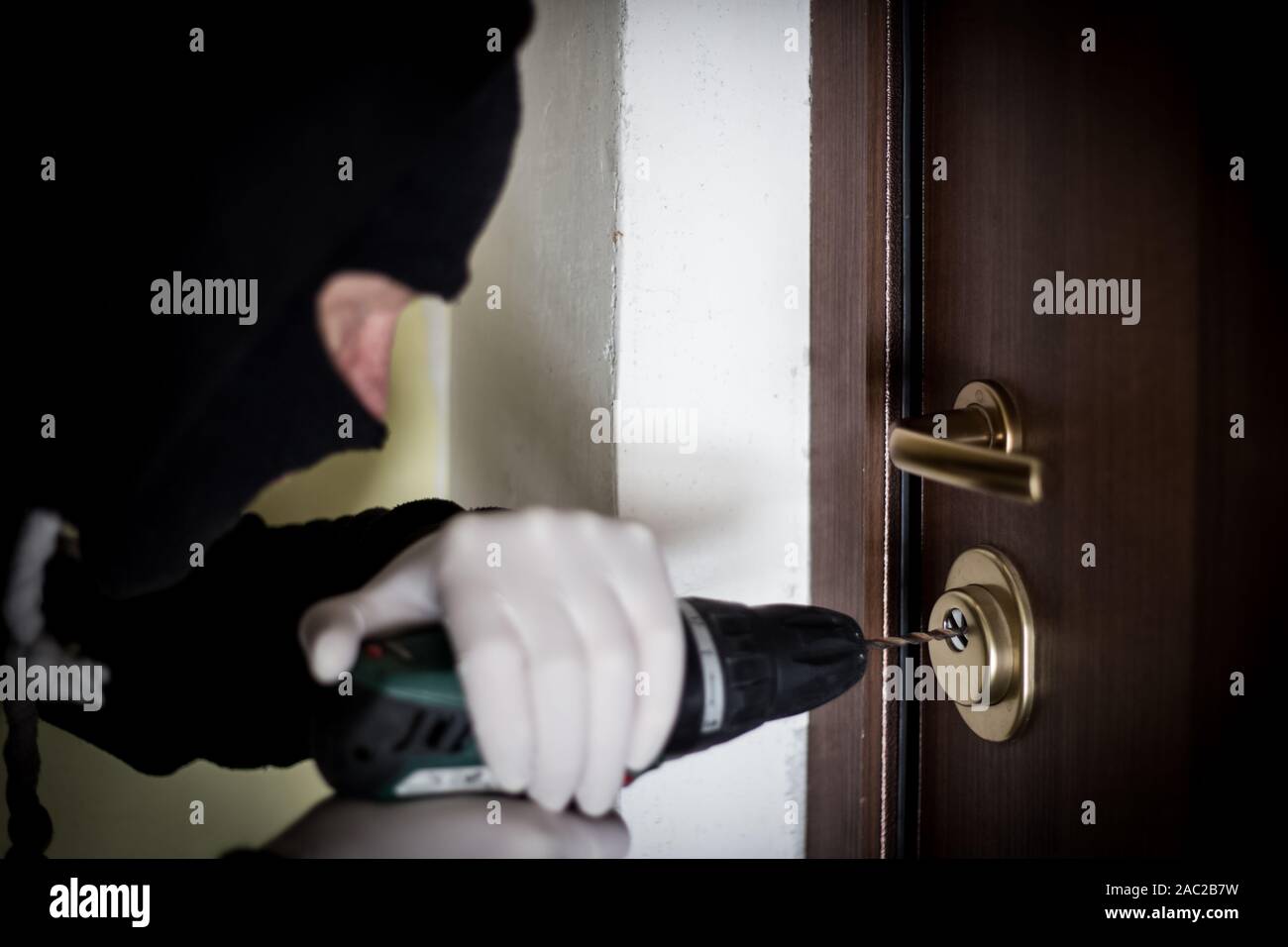 Crime Robbery Masked Thief Burglar Trying To Break Into A Flat