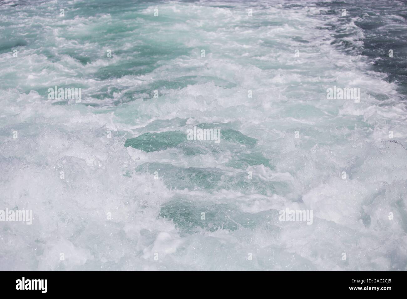 Traces of the ship on the surface of the sea, foam and thunderous waves Stock Photo