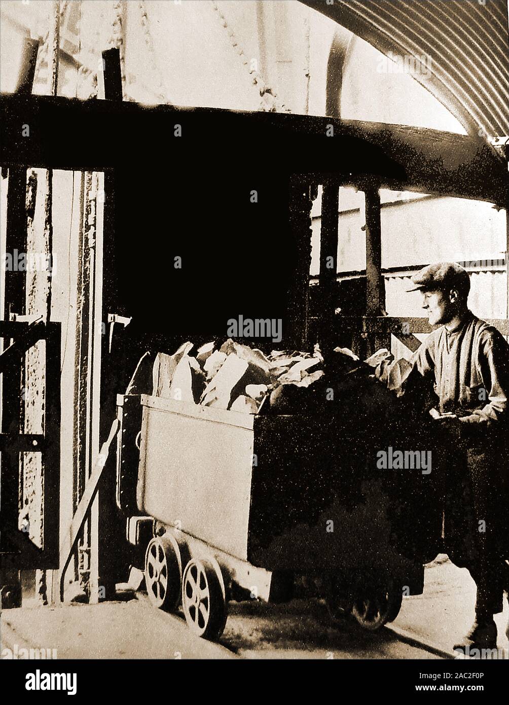 An historic photograph showing a tub of shale arriving at the surface of a shale mine in West Calder, Scotland. Burngrange Shale Mine was owned by Young's Paraffin Light & Mineral Oil Co., Ltd.when on  10 January 1947, the mine experienced   its worst underground mining disaster. Fifteen miners perished when firedamp was ignited by an open acetylene cap lamp Stock Photo
