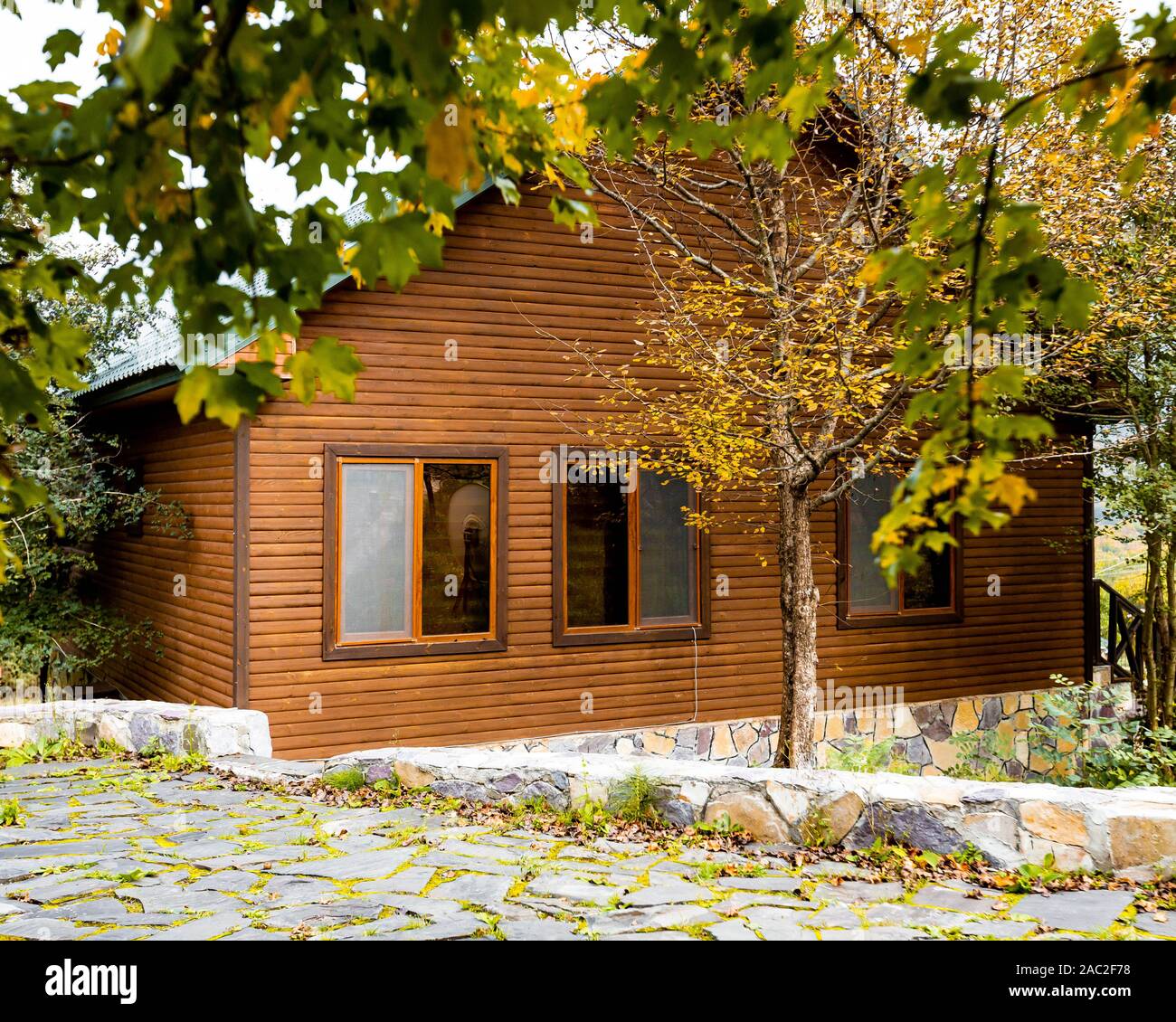 gorgeous wooden house in the forest Stock Photo - Alamy
