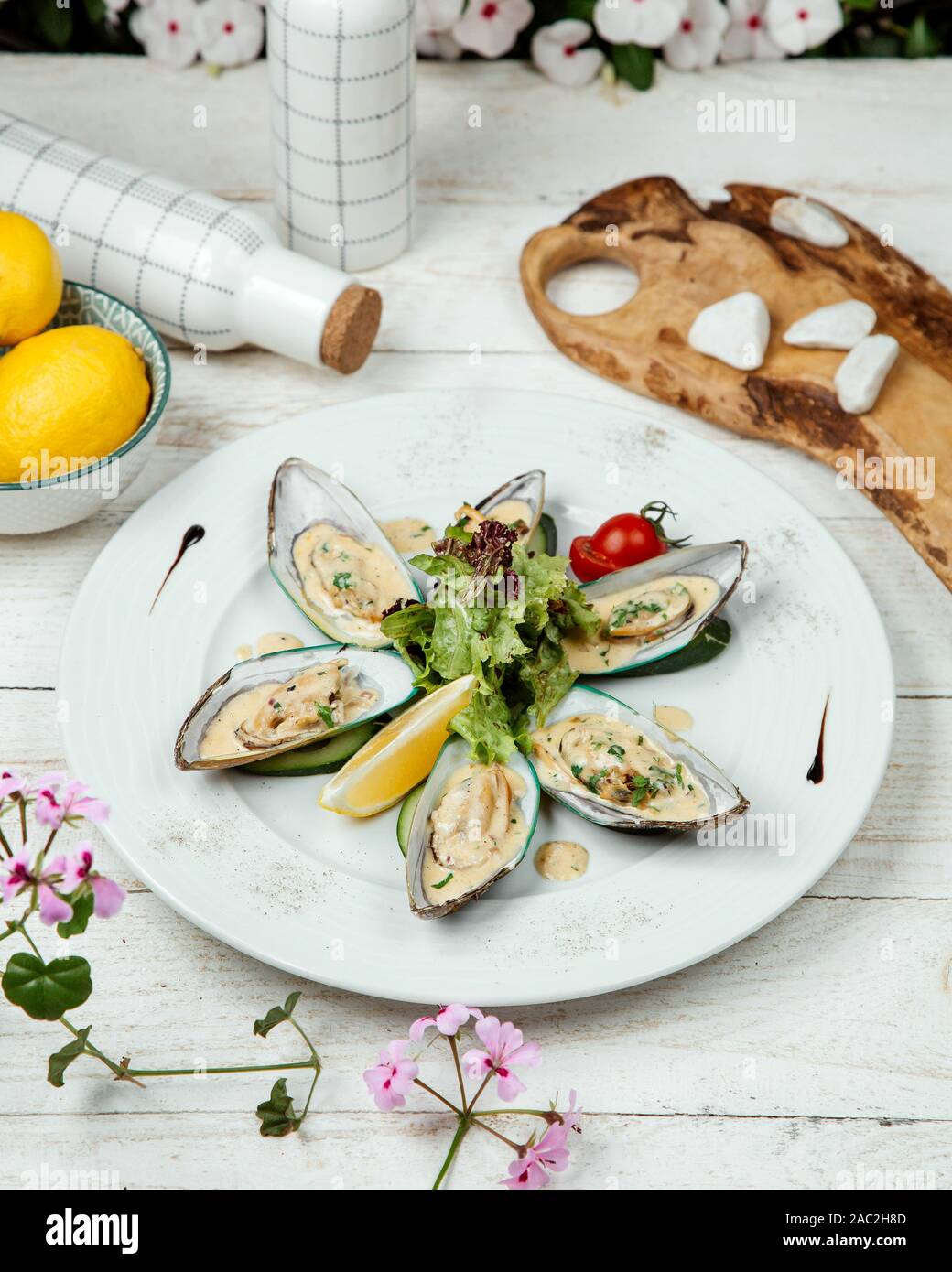 oysters in sour cream sauce and herbs Stock Photo Alamy