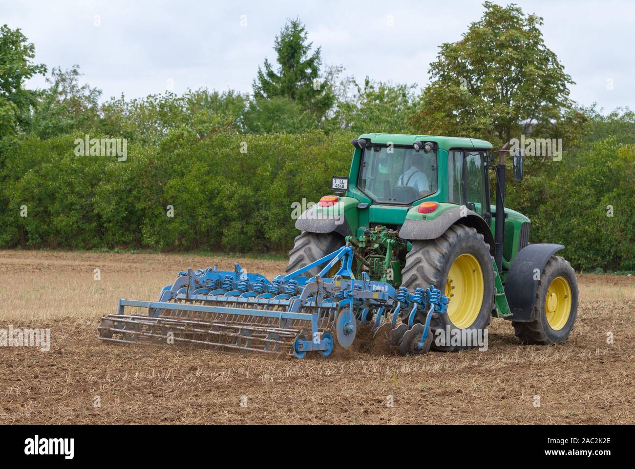 LATVIA, TUKUMS - 26 AUGUST: Conventional deep plowing with metal disks on 26 August 2018, Tukums district, Latvia. Stock Photo