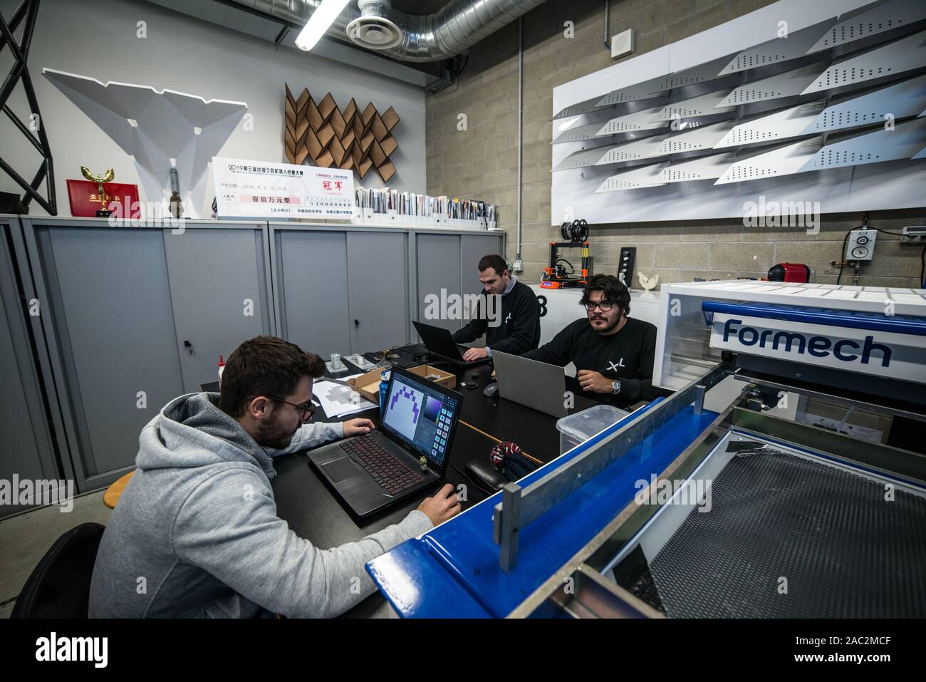 Architects and engineers at work into the lab - Indexlab, digital design and fabrication laboratory, Politecnico di Milano, Lecco, Italy - November 20 Stock Photo