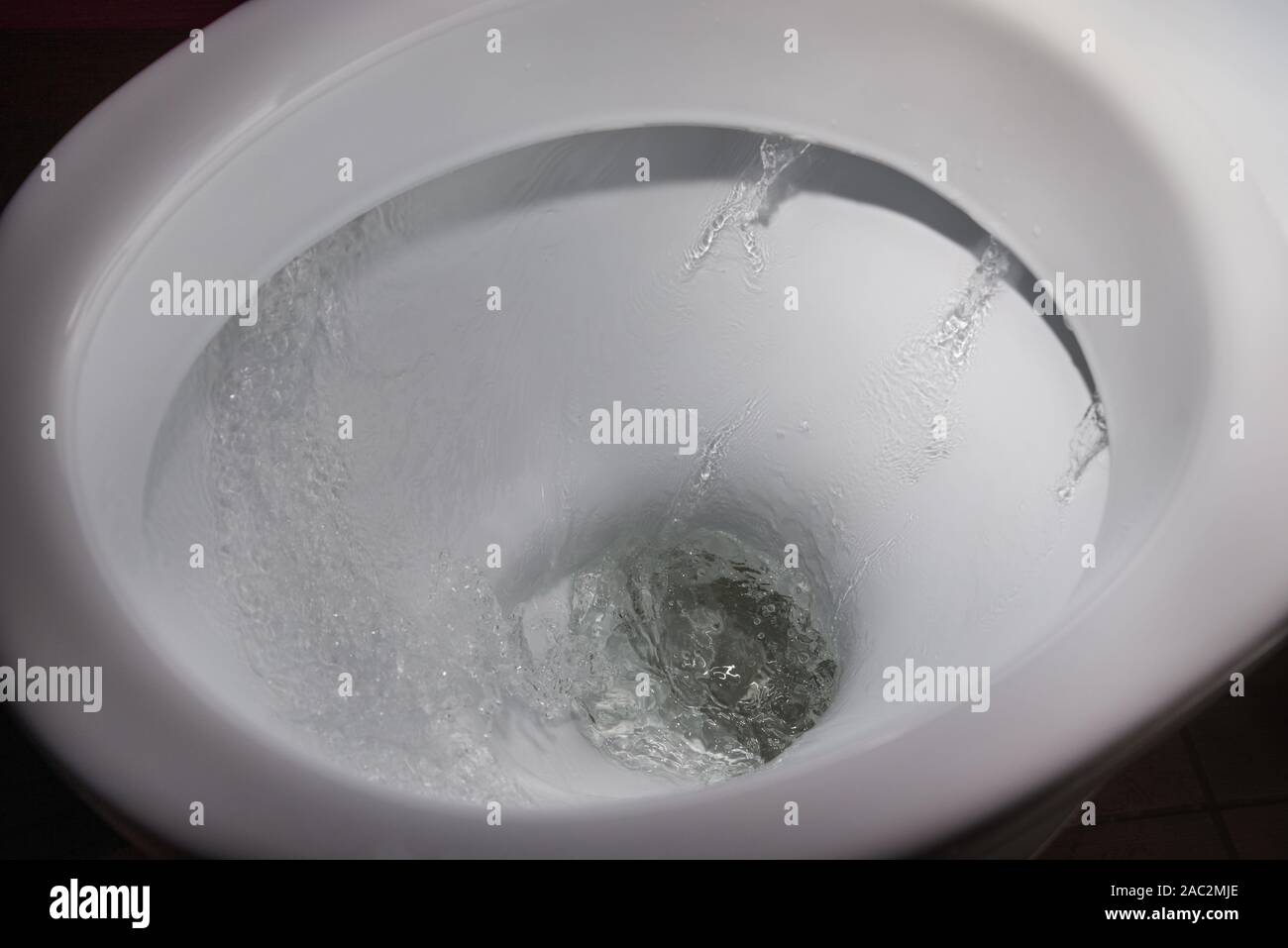 Water flushing in toilet bowl Stock Photo Alamy