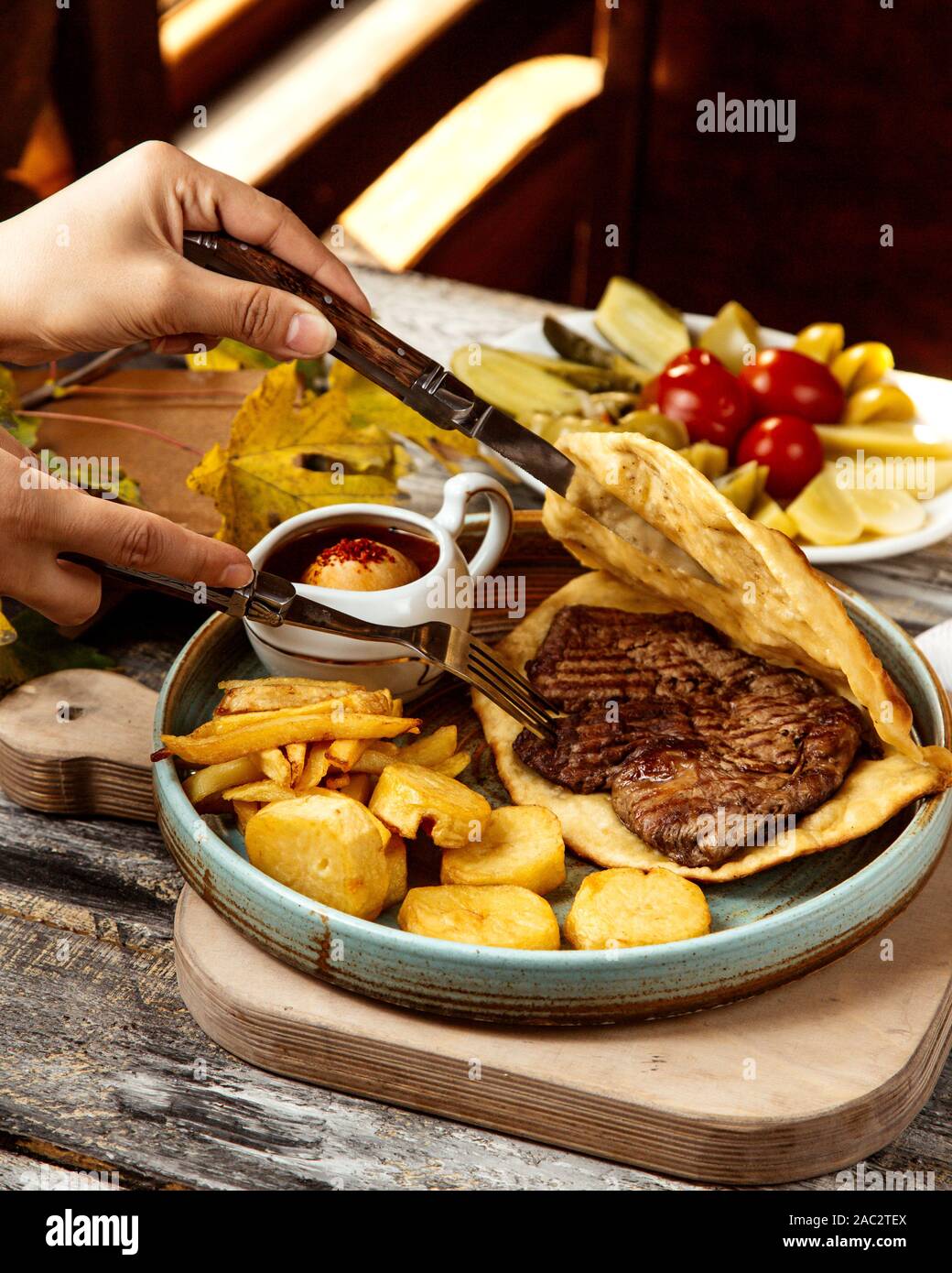 roasted meat inside the bread and fries Stock Photo Alamy