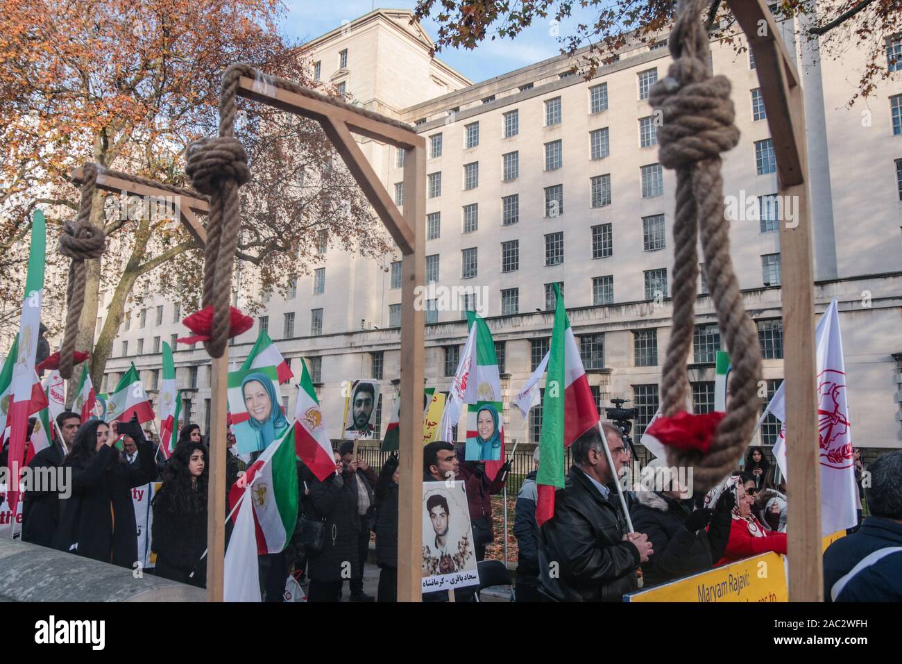 London, UK. 30th Nov, 2019. The Anglo Iranian Communities in UK and supporters of the National Council of Resistance of Iran(NCRI) held a rally opposite Downing Street in support of the ongoing popular protest in Iran that have turned into an uprising against the clerical regime.Over 450. Protesters were killed and 4000 injured when the IRCG and security forces opened fire on them.As Many as 10.000 has been arrested, A woman holding a photo of one of those killed .Paul Quezada-Neiman/Alamy Live News Credit: Paul Quezada-Neiman/Alamy Live News Stock Photo