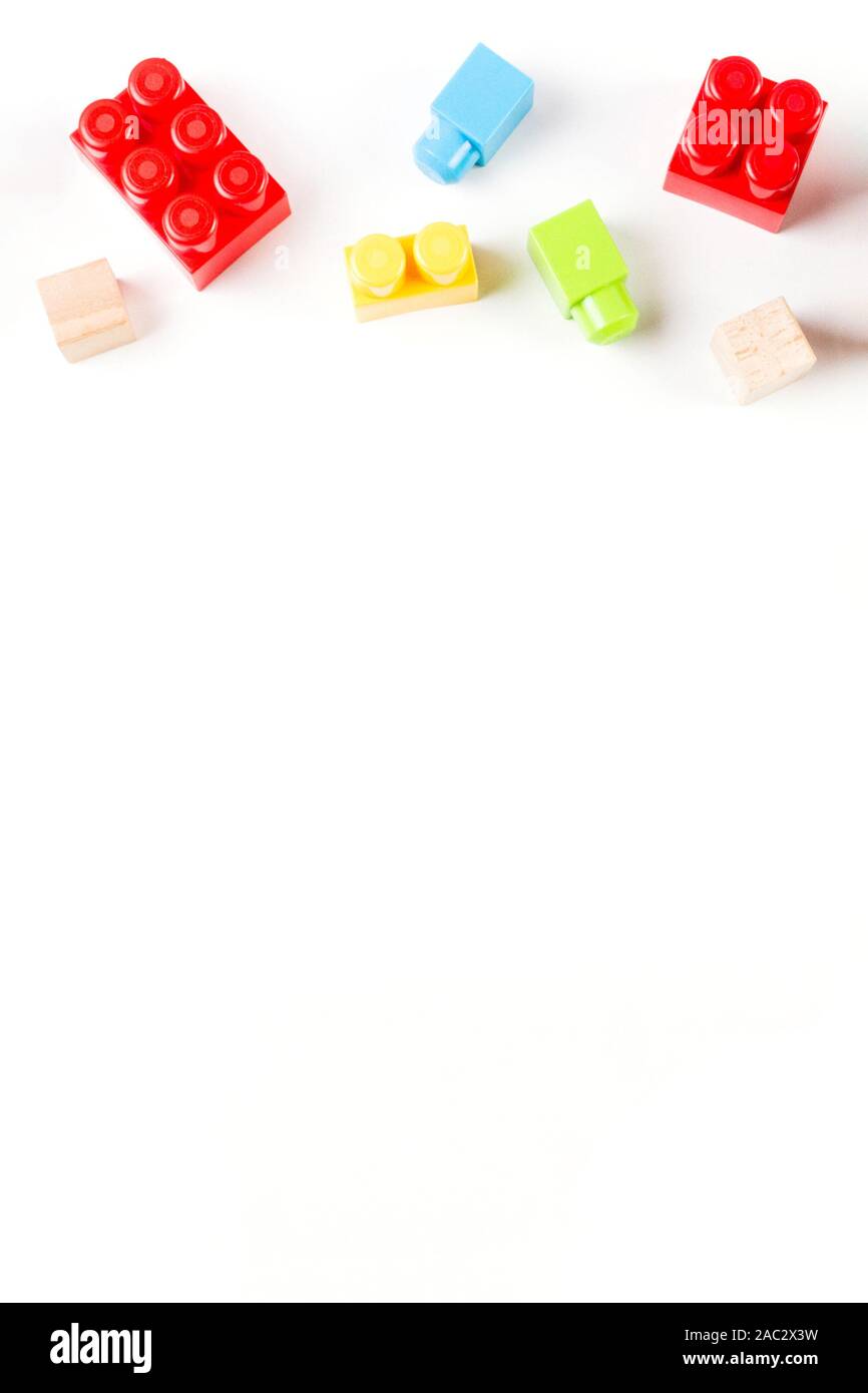 Toys background. Colorful wooden cubes and plastic construction blocks ...