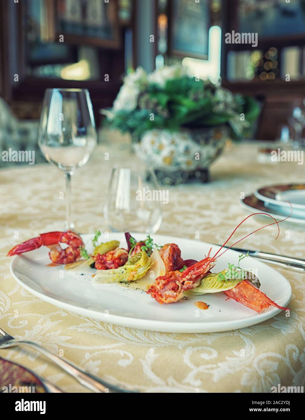 Red shrimp appetizer in an expensive restaurant, toned image Stock Photo