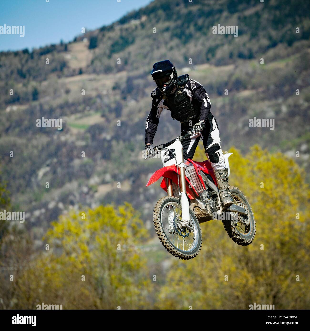 moto cross in action in dirt road Stock Photo