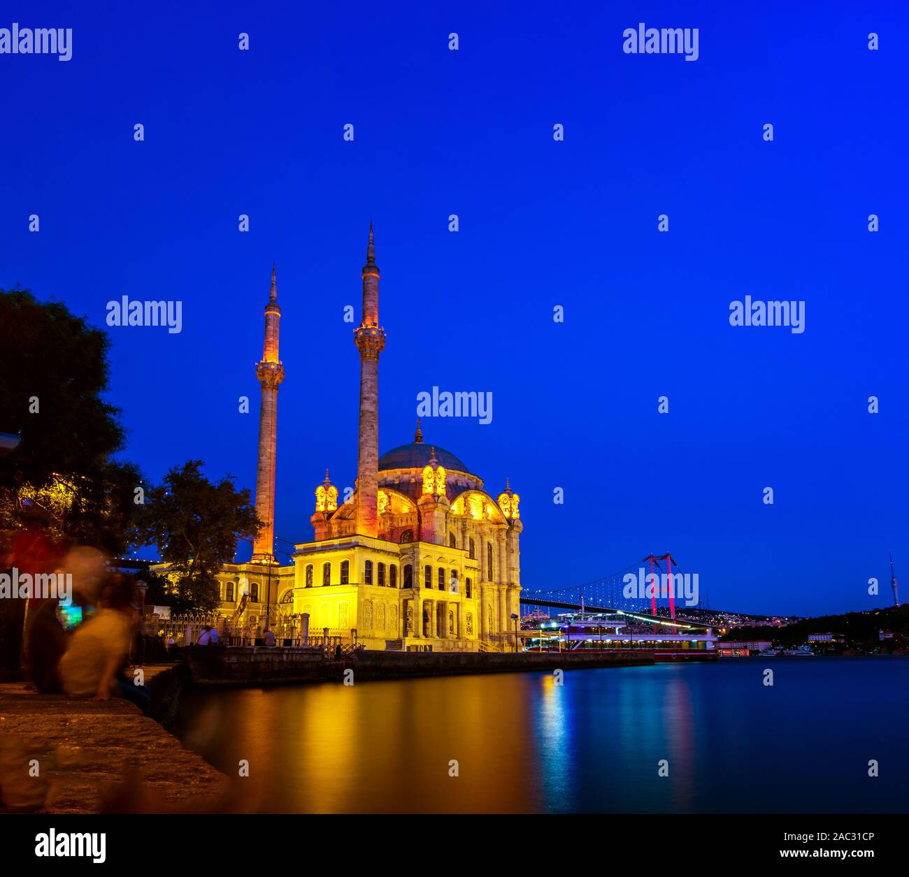 Ortakoy Mosque and the Bosphorus Bridge at night in Istanbul, Turkey. Stock Photo