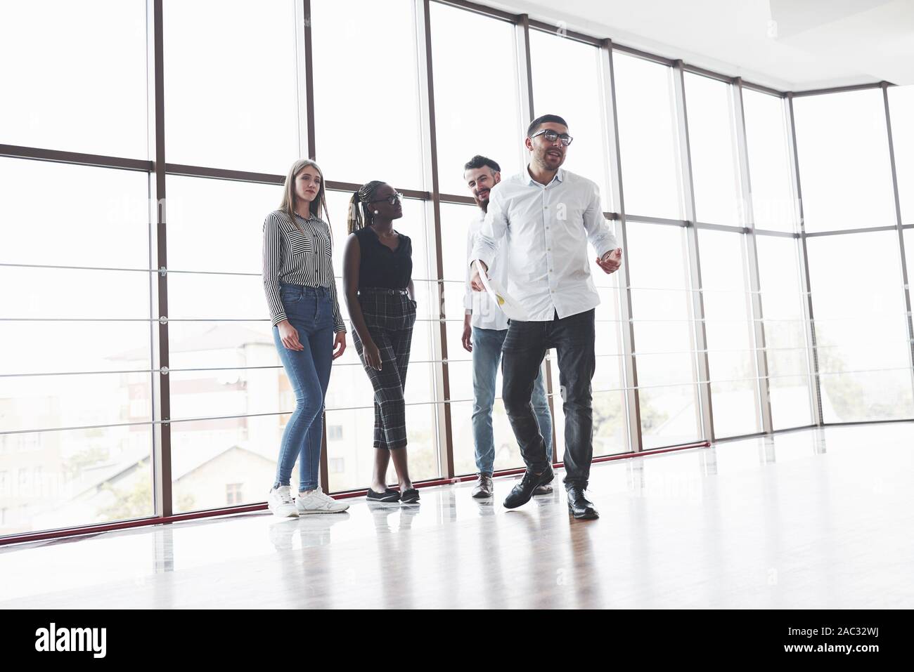 Having conversation. Friendly atmophere between four team workers on the break time Stock Photo