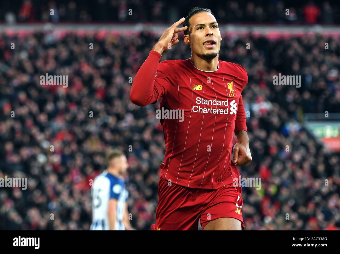 Liverpool's Virgil van Dijk celebrates scoring his sides first goal during  the Premier League match at Anfield, Liverpool Stock Photo - Alamy