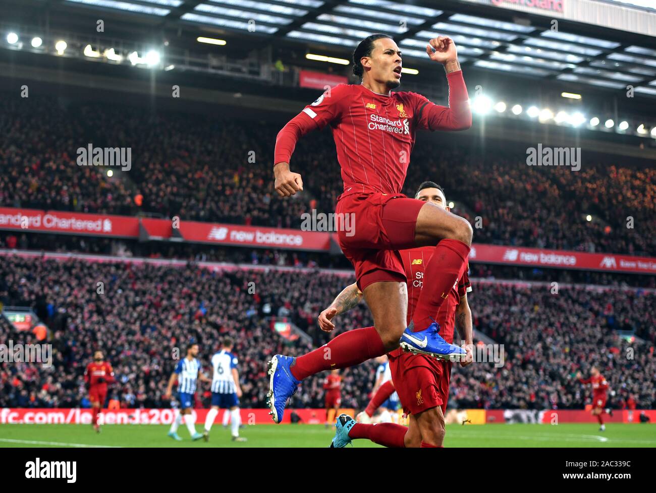 Liverpool's Virgil van Dijk celebrates scoring his sides first goal during  the Premier League match at Anfield, Liverpool Stock Photo - Alamy