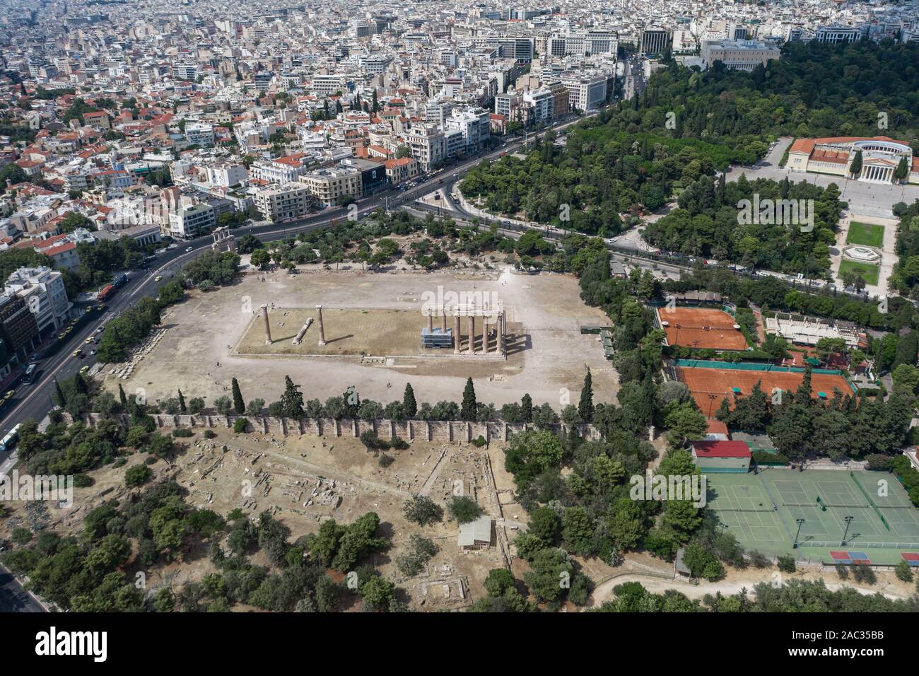 Aerial drone shot of temple ruins at Archaeological Site of Olympieion and zappeion hall in Athens Stock Photo