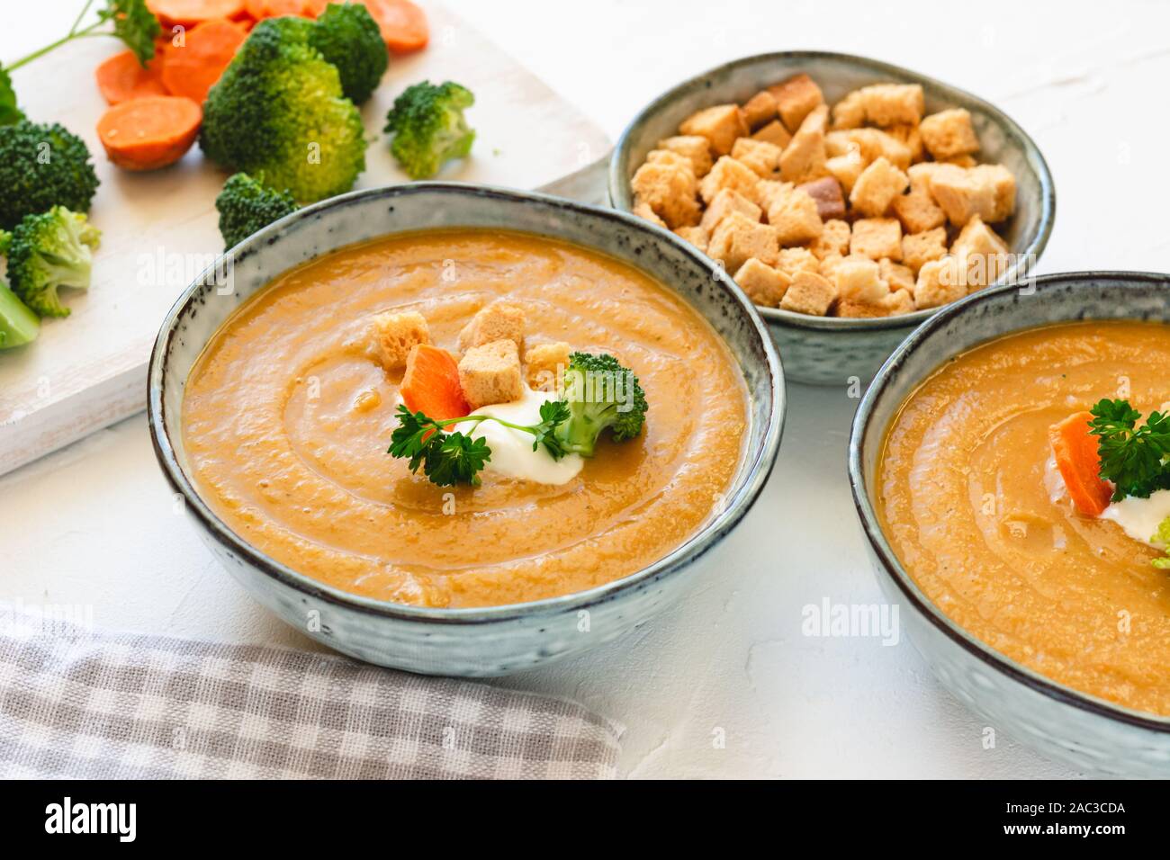 Cream vegetable soup broccoli, carrot, cauliflower with croutons. Vegetarian healthy food on