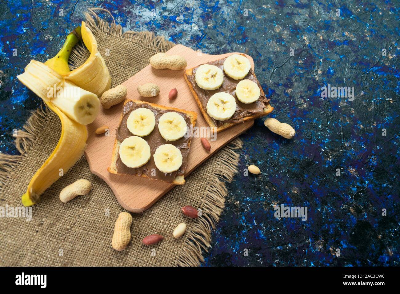 Toast with chocolate peanut butter and banana. Top view. Stock Photo