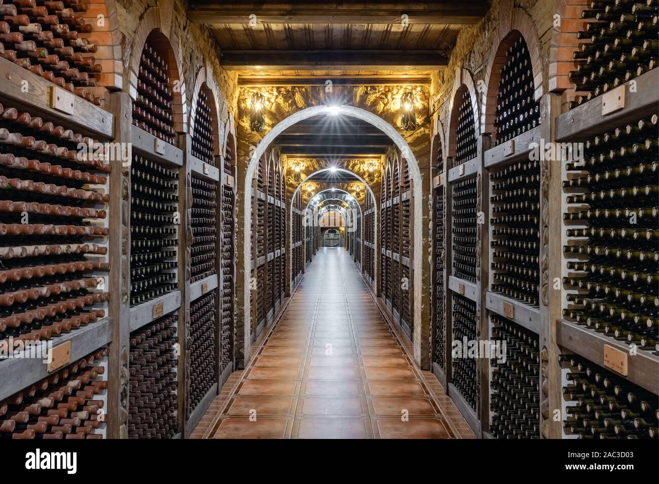 Wine bottles stacked up in underground wine cellar Stock Photo Alamy