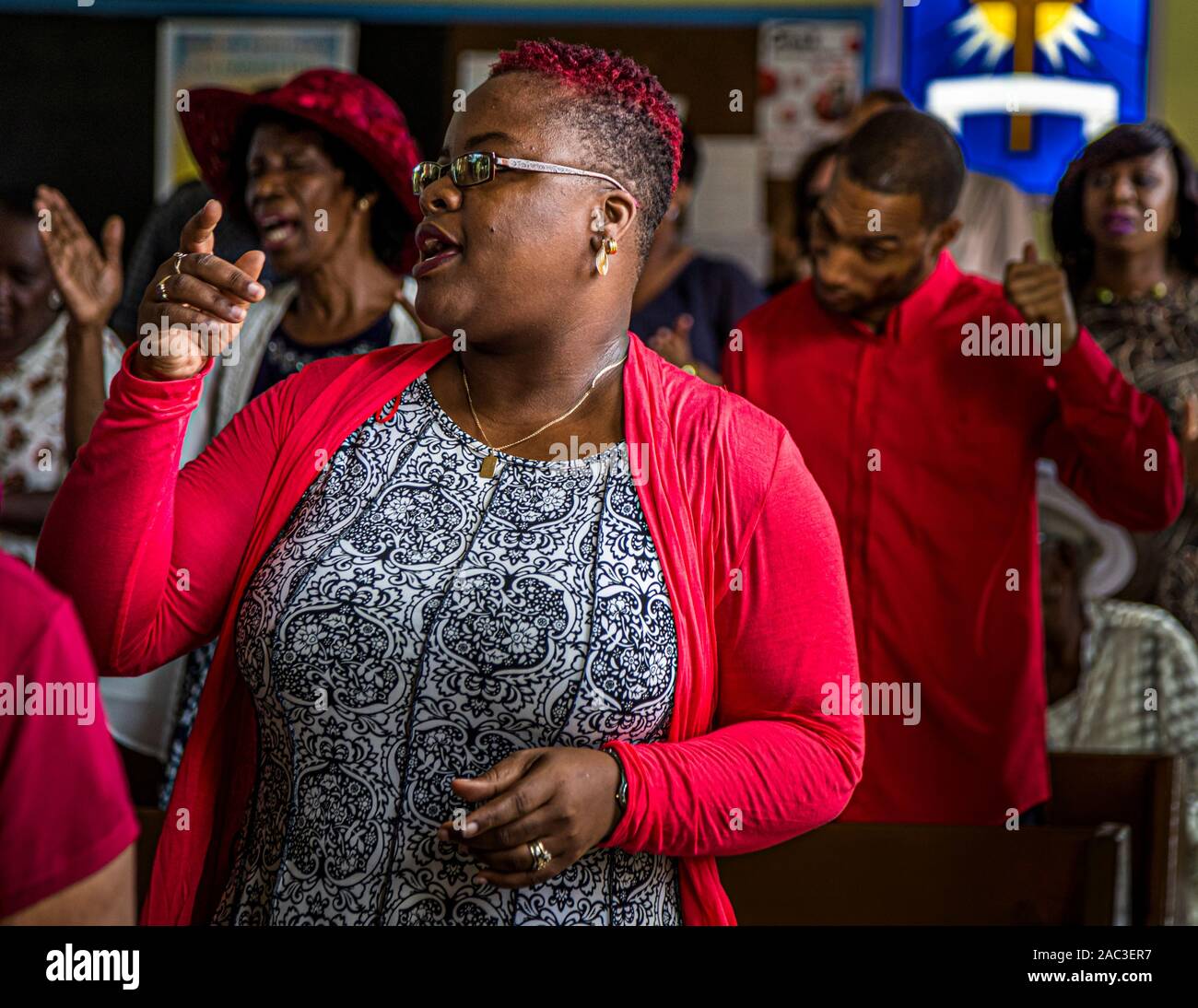 Worshippers sing at Baptist service in The Lime, Grenada Stock Photo