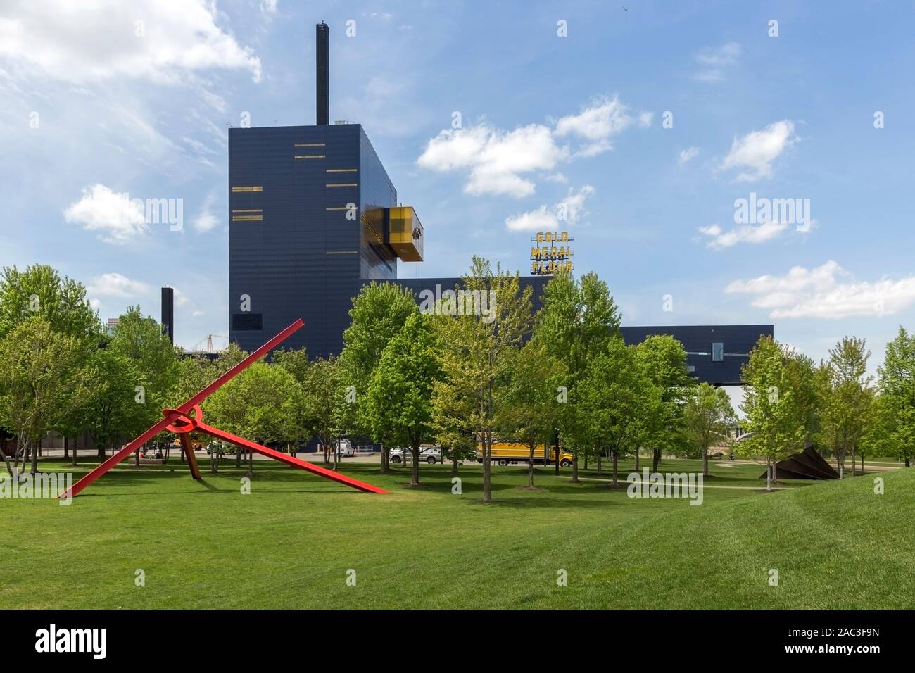 The Guthrie Theater and the 1977-1983 red metal painted sculpture Molecule by sculptor Mark di Suvero in Gold Medal Park in downtown Minneapolis, Minn Stock Photo